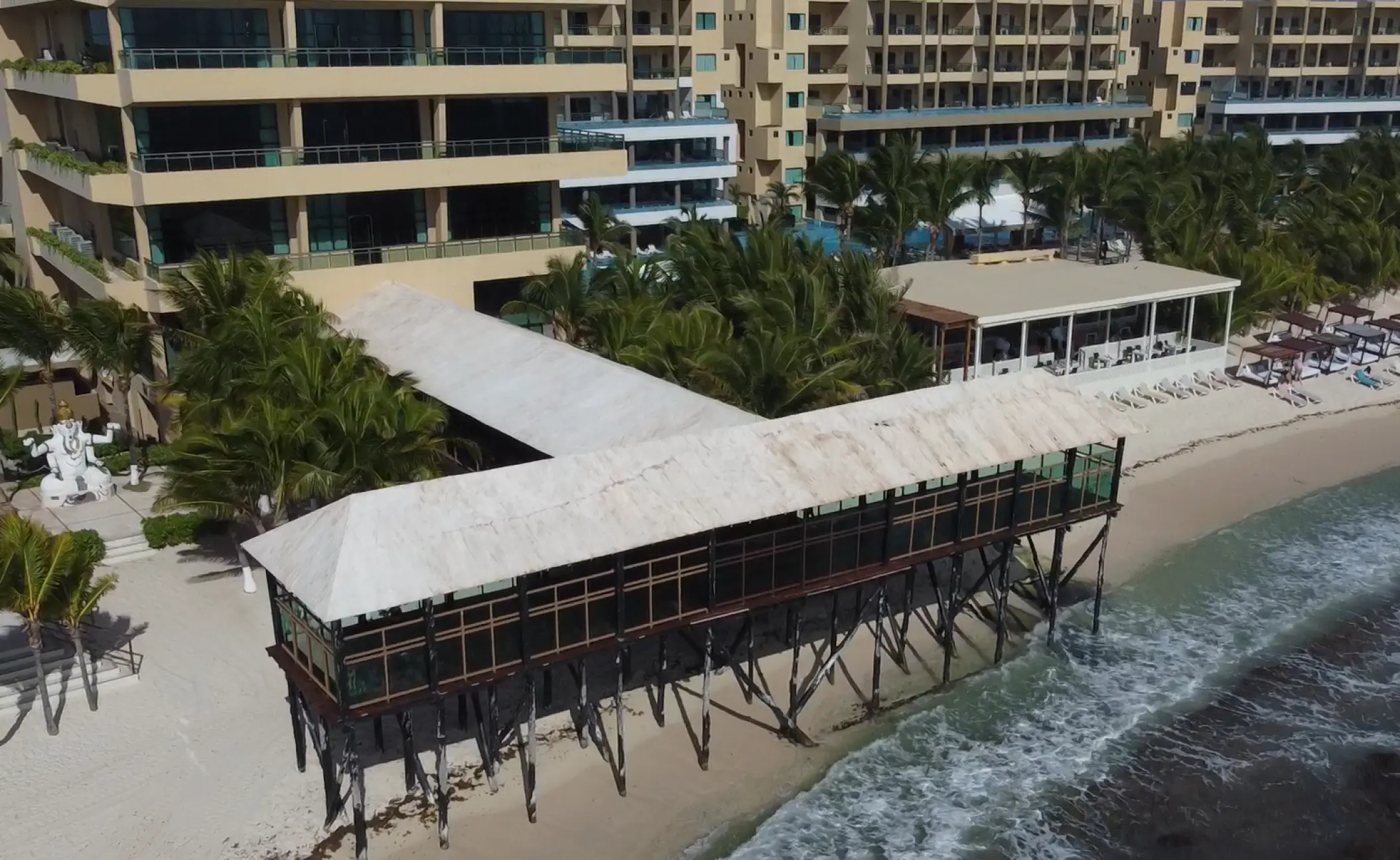 Aerial view of the covered pier wedding venue at Generations Riviera Maya