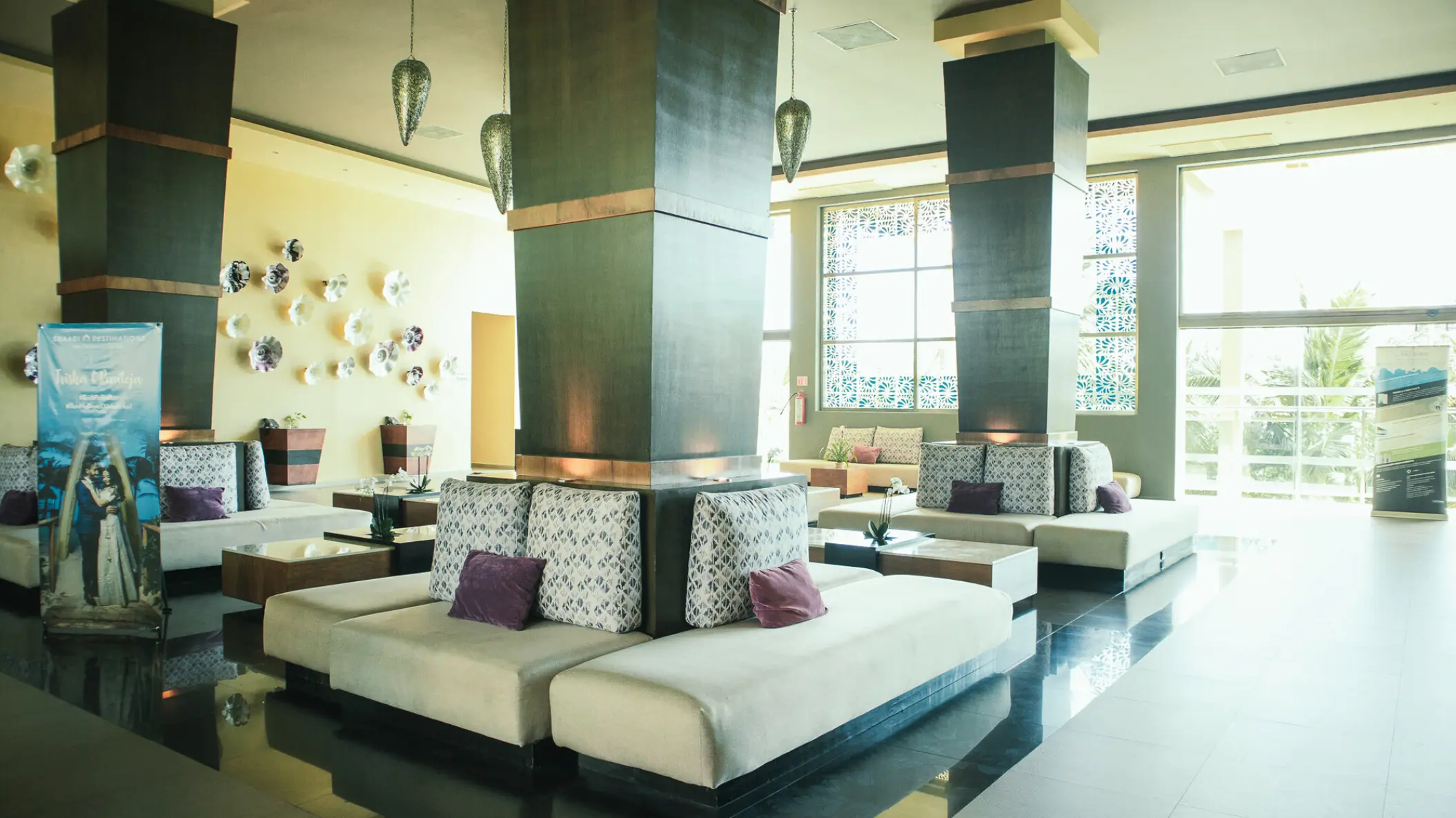 Generations Riviera Maya lobby lounge with patterned seating and large decorative pillars, Riviera Maya