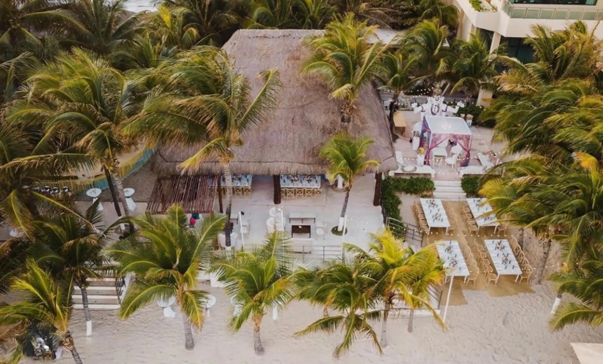 Aerial view of a wedding reception setup at the Palapa Ganesha, Generations Riviera Maya