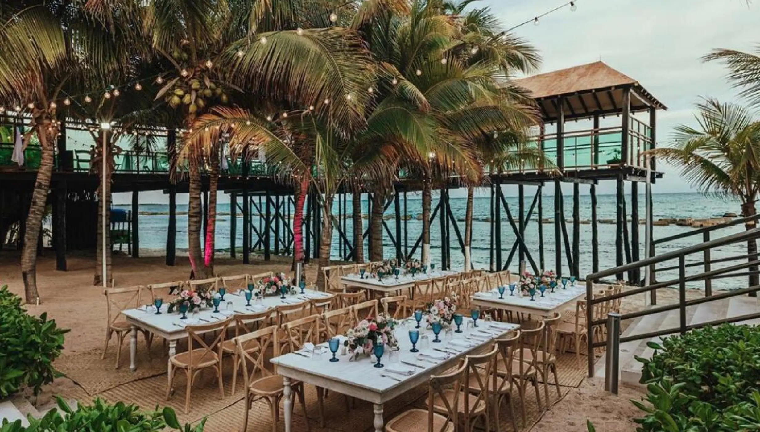 beach reception venue with palm trees at Generations Riviera Maya resort