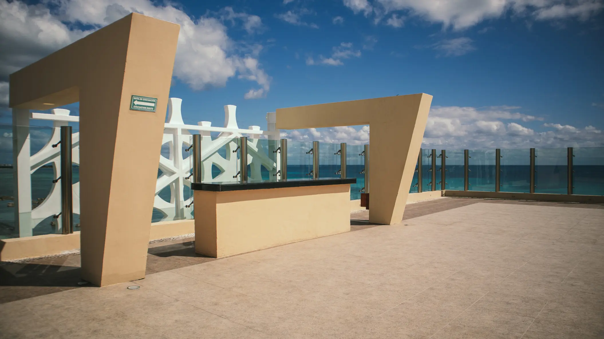 Sky Deck rooftop venue with geometric arches overlooking the ocean at Generations Riviera Maya