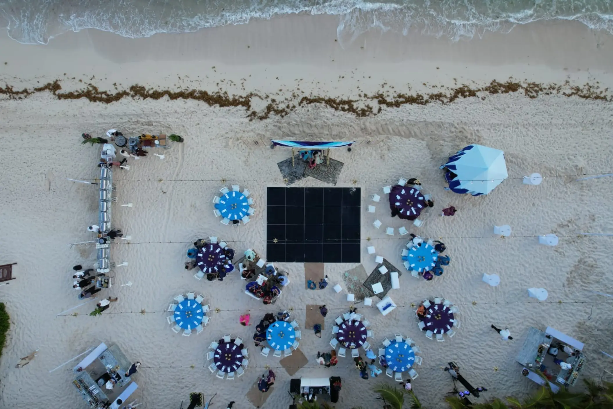 Aerial view of a beach wedding reception at Generations Riviera Maya