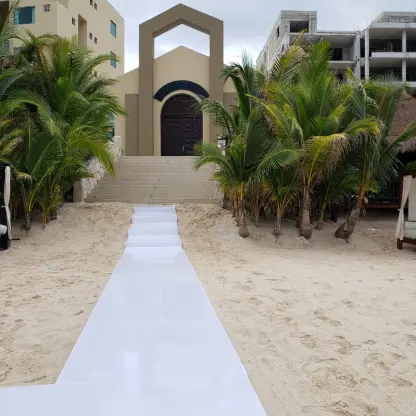 White runner on the sand leading to the beach chapel at Generations Riviera Maya