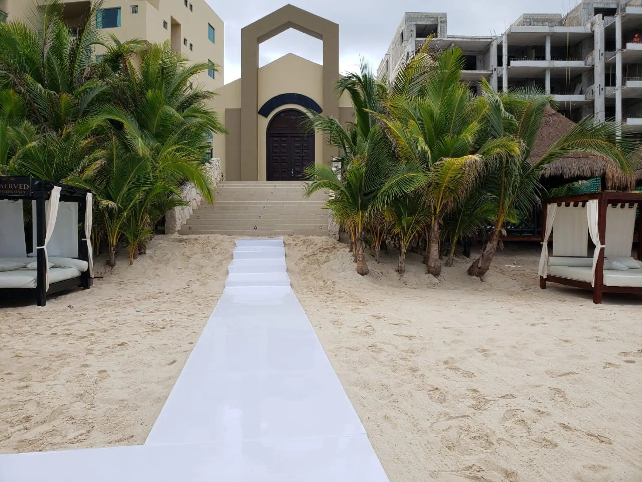 White runner on the sand leading to the beach chapel at Generations Riviera Maya