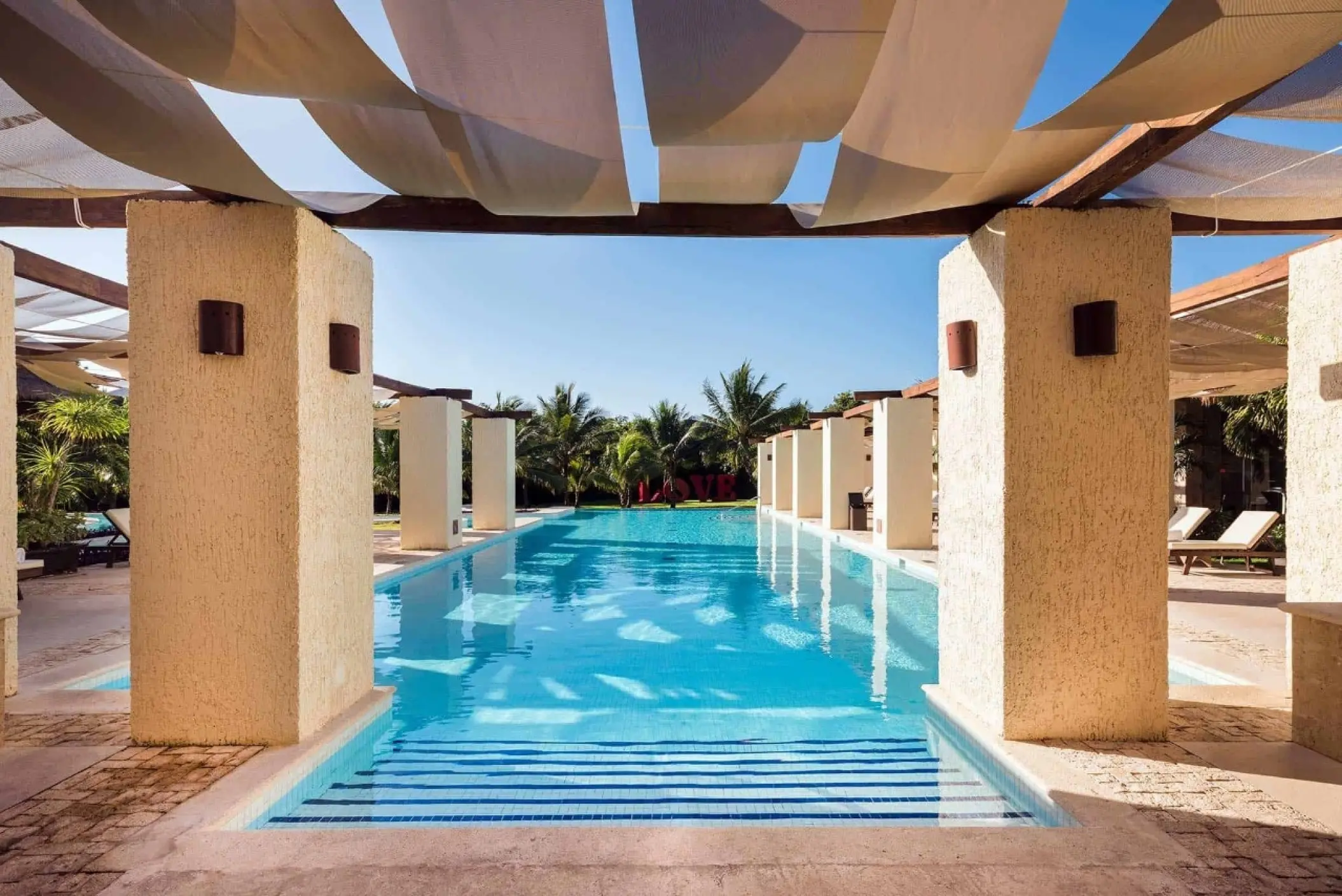 Grand Palladium Colonial outdoor swimming pool under shaded awnings, Riviera Maya