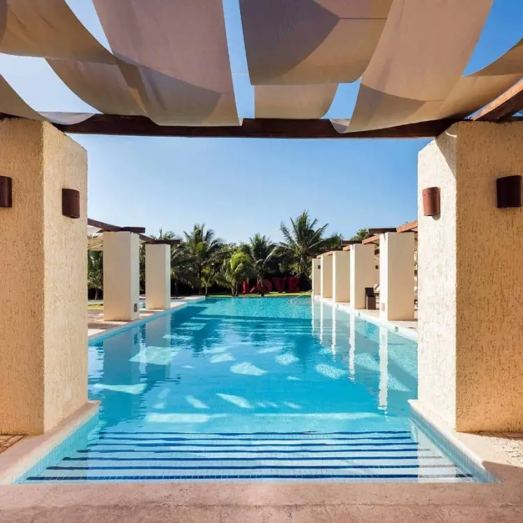 Grand Palladium Colonial outdoor swimming pool under shaded awnings, Riviera Maya