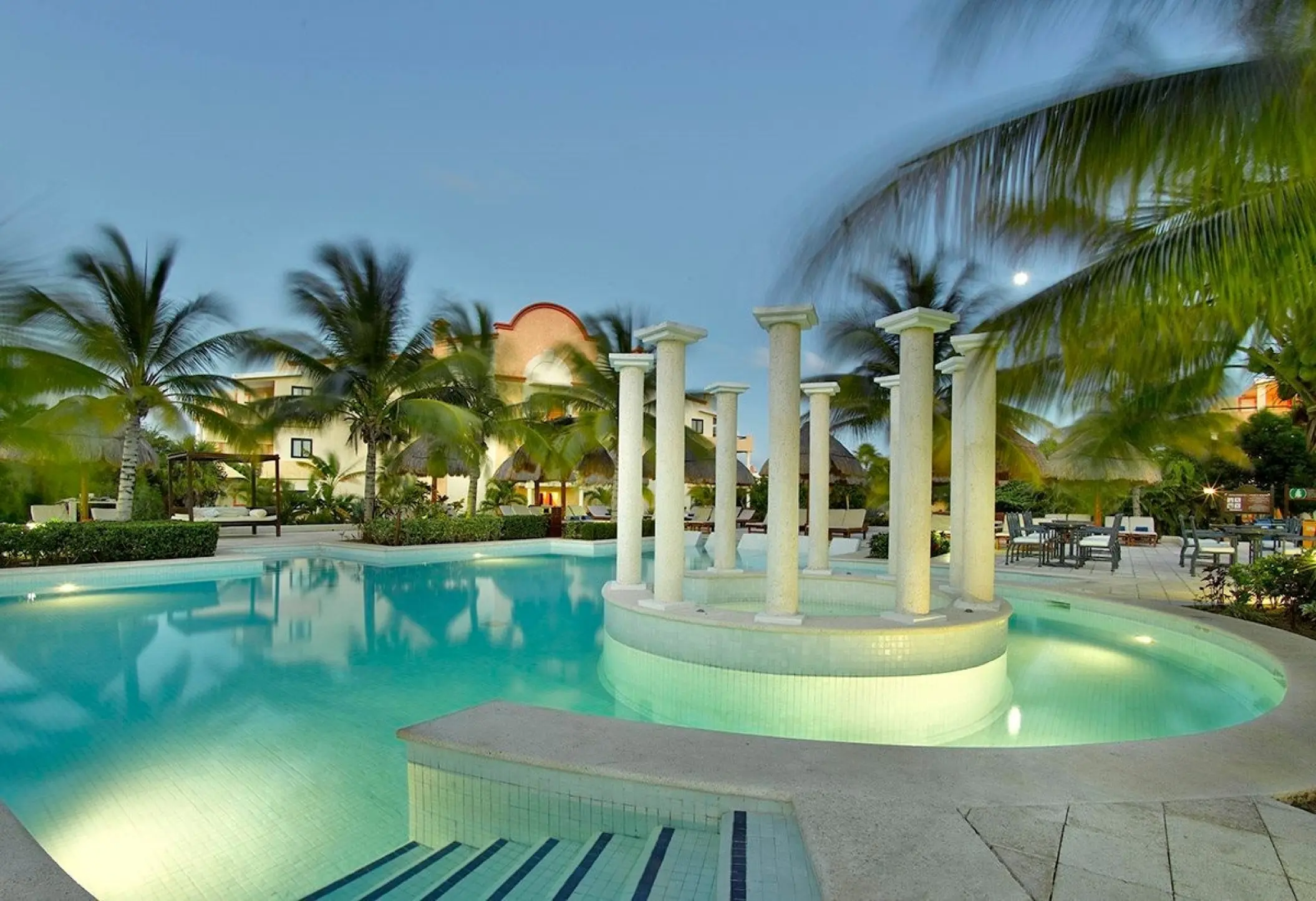 El Secreto pool and wedding venue with white columns at Grand Palladium Colonial, Riviera Maya