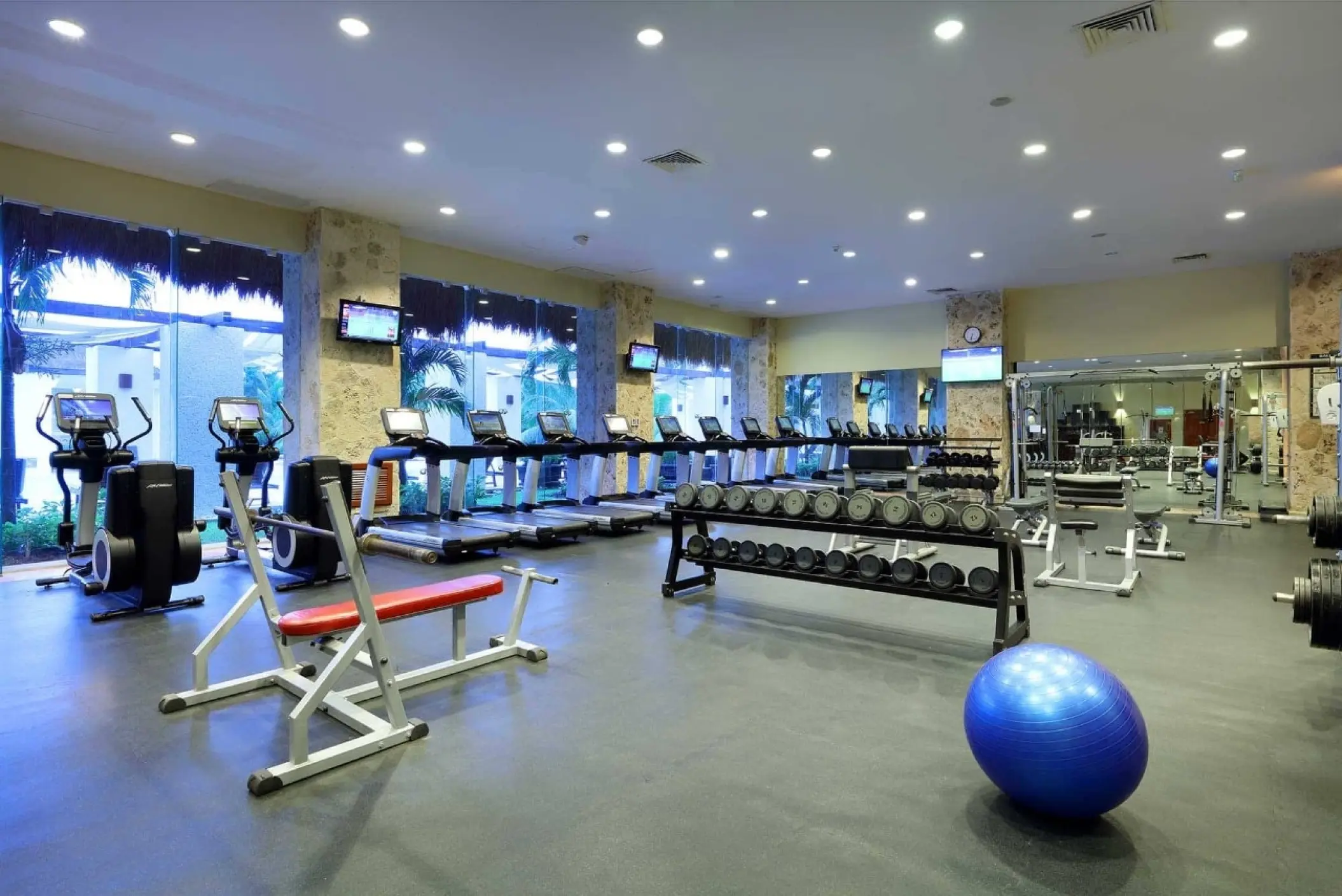 Fitness center with treadmills, free weights, and gym equipment at Grand Palladium Colonial, Riviera Maya
