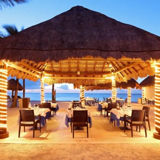 Poseidon restaurant at Grand Palladium Colonial overlooking the ocean at dusk, Riviera Maya
