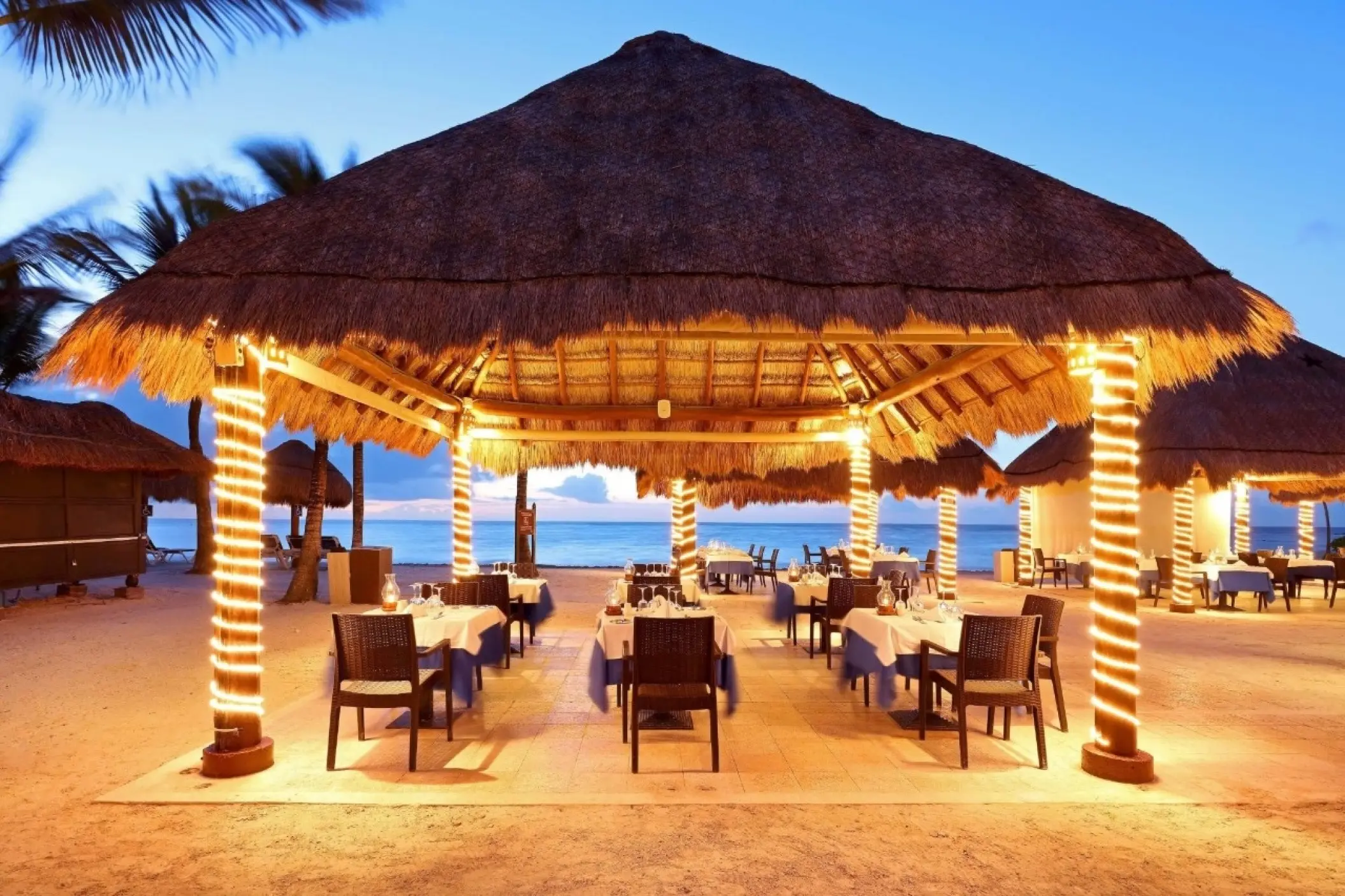 Poseidon restaurant at Grand Palladium Colonial overlooking the ocean at dusk, Riviera Maya