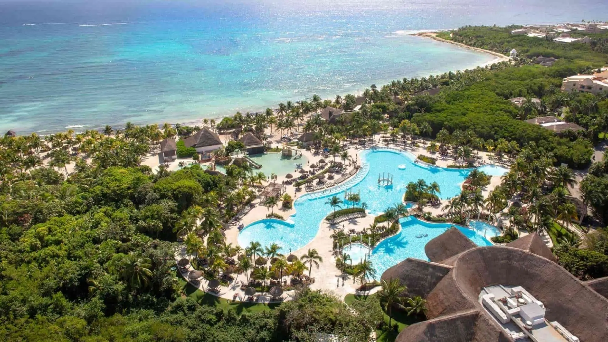 Aerial view of Grand Palladium Colonial lagoon pools and beachfront, Riviera Maya