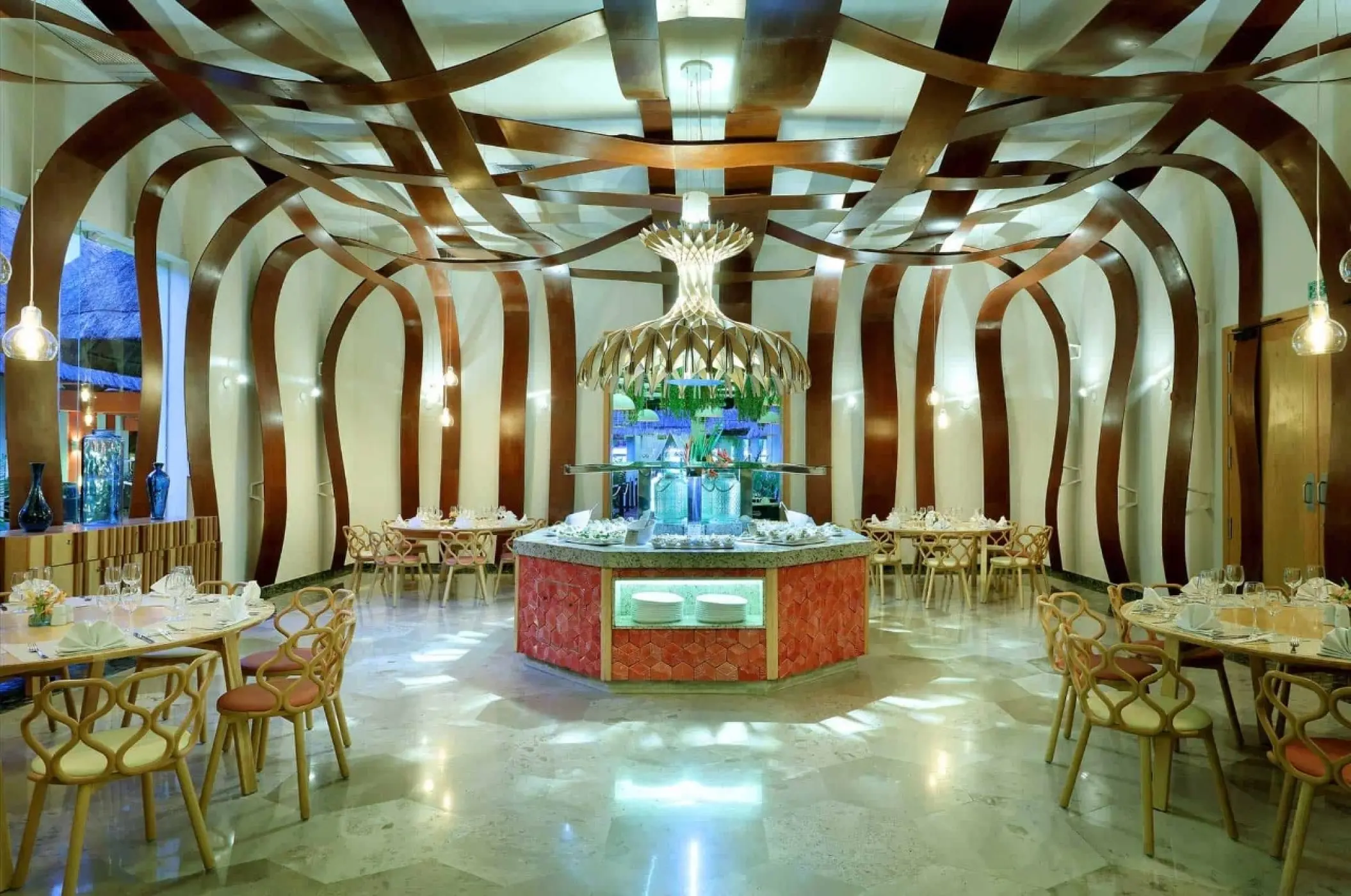 Modern restaurant with curved wood architectural details at Grand Palladium Colonial, Riviera Maya