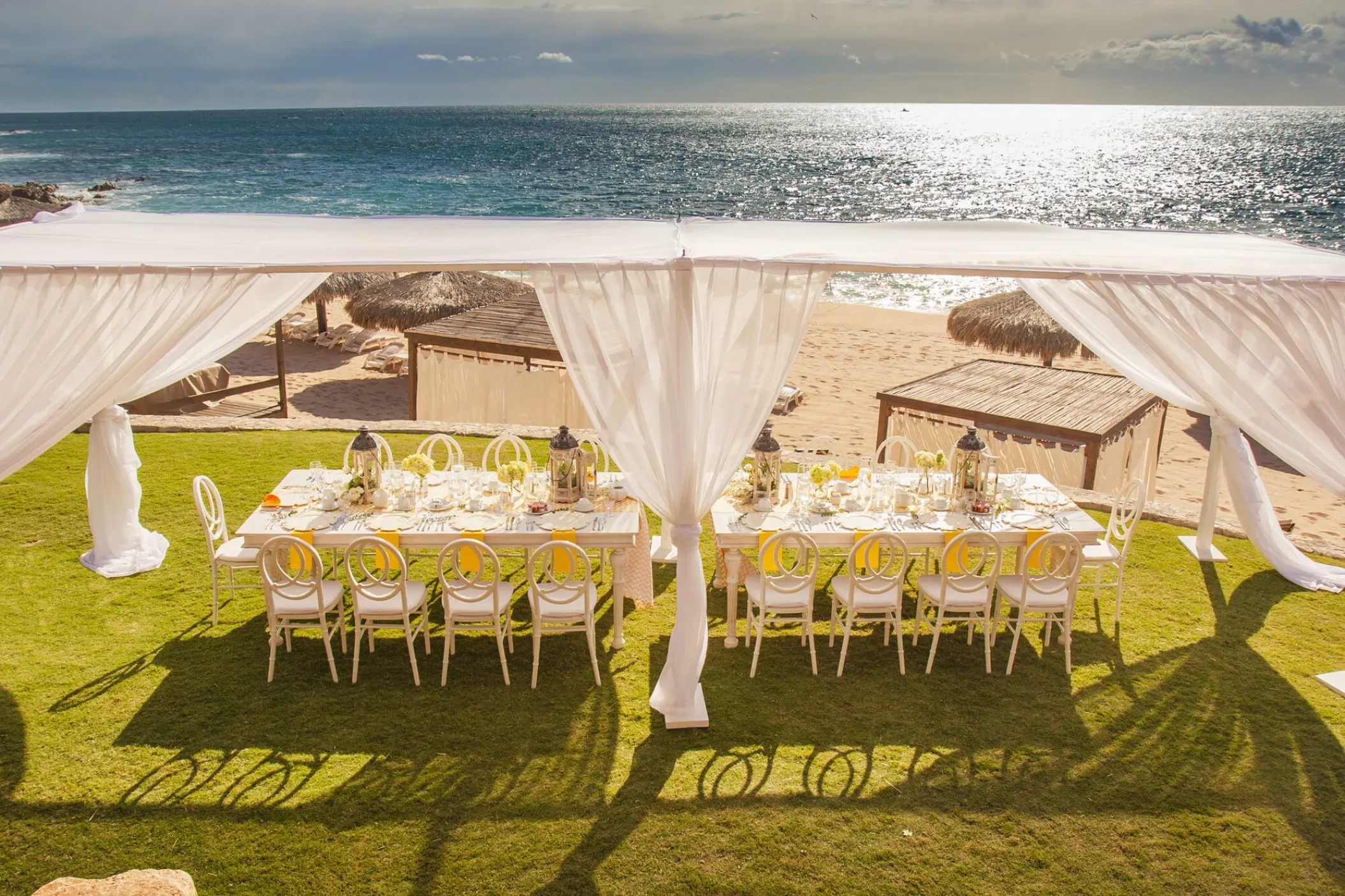 Outdoor wedding reception under a white canopy at Grand Fiesta Americana Los Cabos, Cabo San Lucas