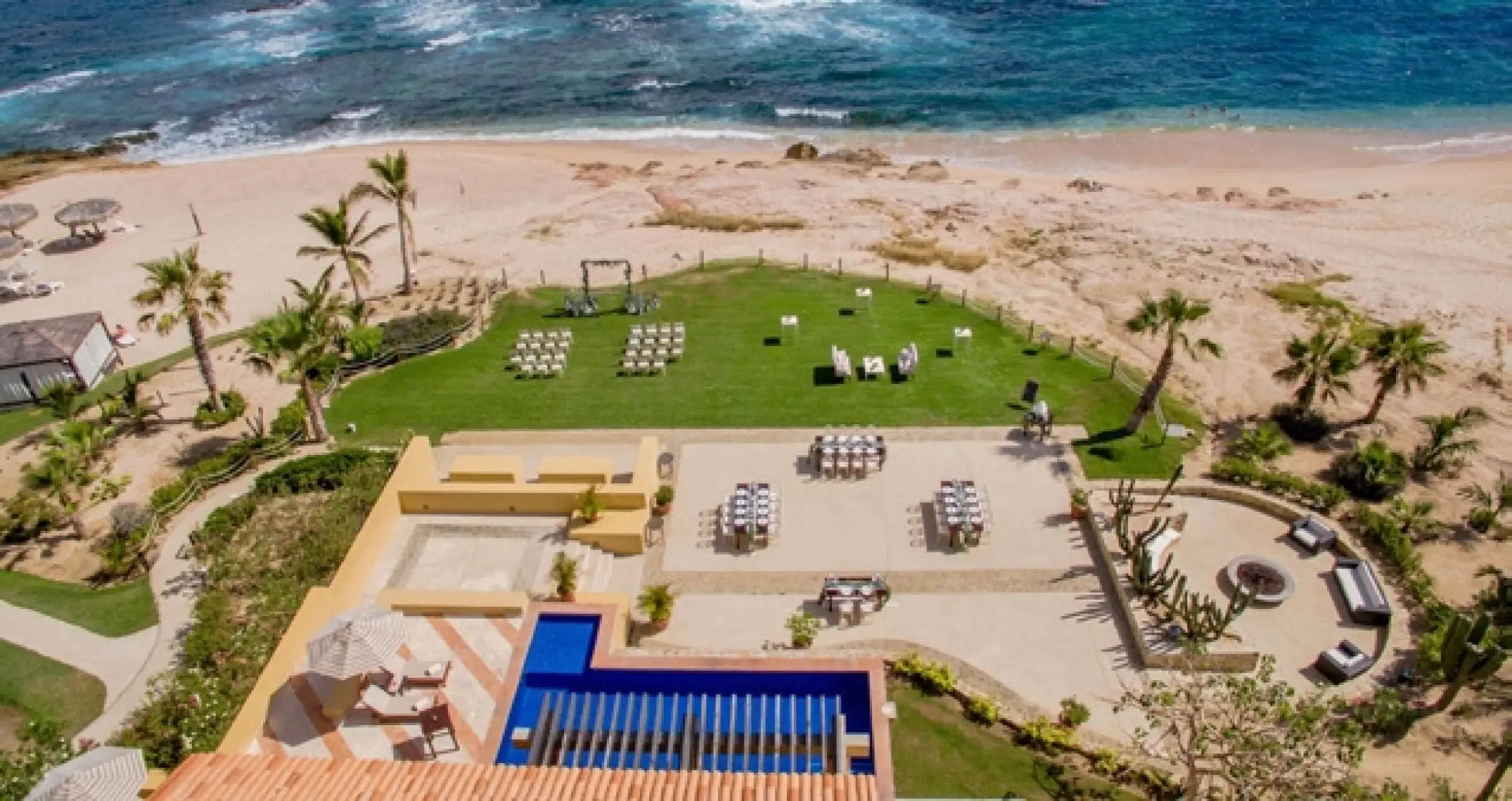 Aerial view of a wedding ceremony and reception setup at Grand Fiesta Americana, Cabo San Lucas