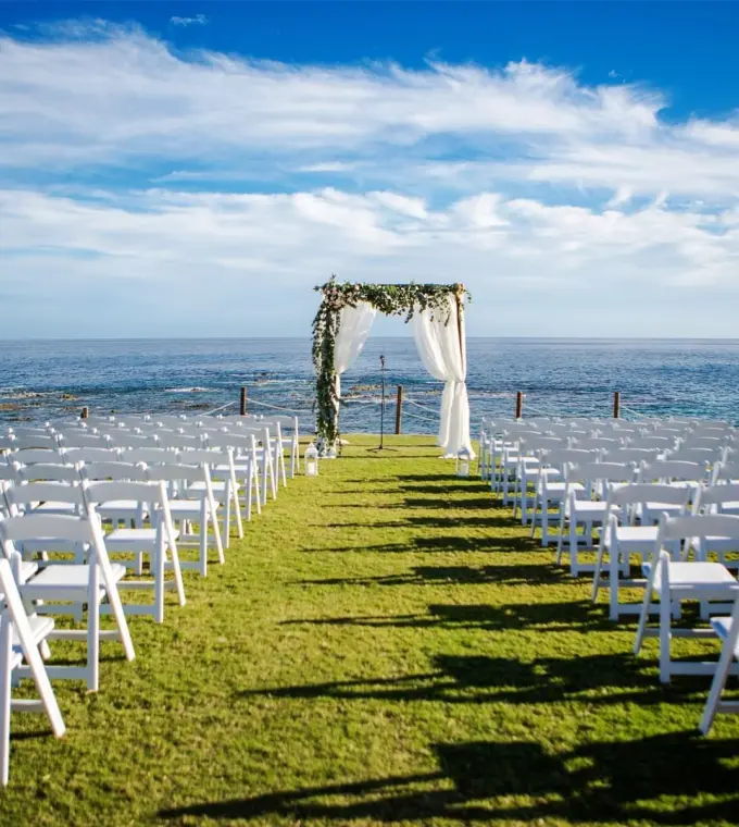 Oceanfront wedding ceremony on a lawn at Grand Fiesta Americana, Cabo San Lucas