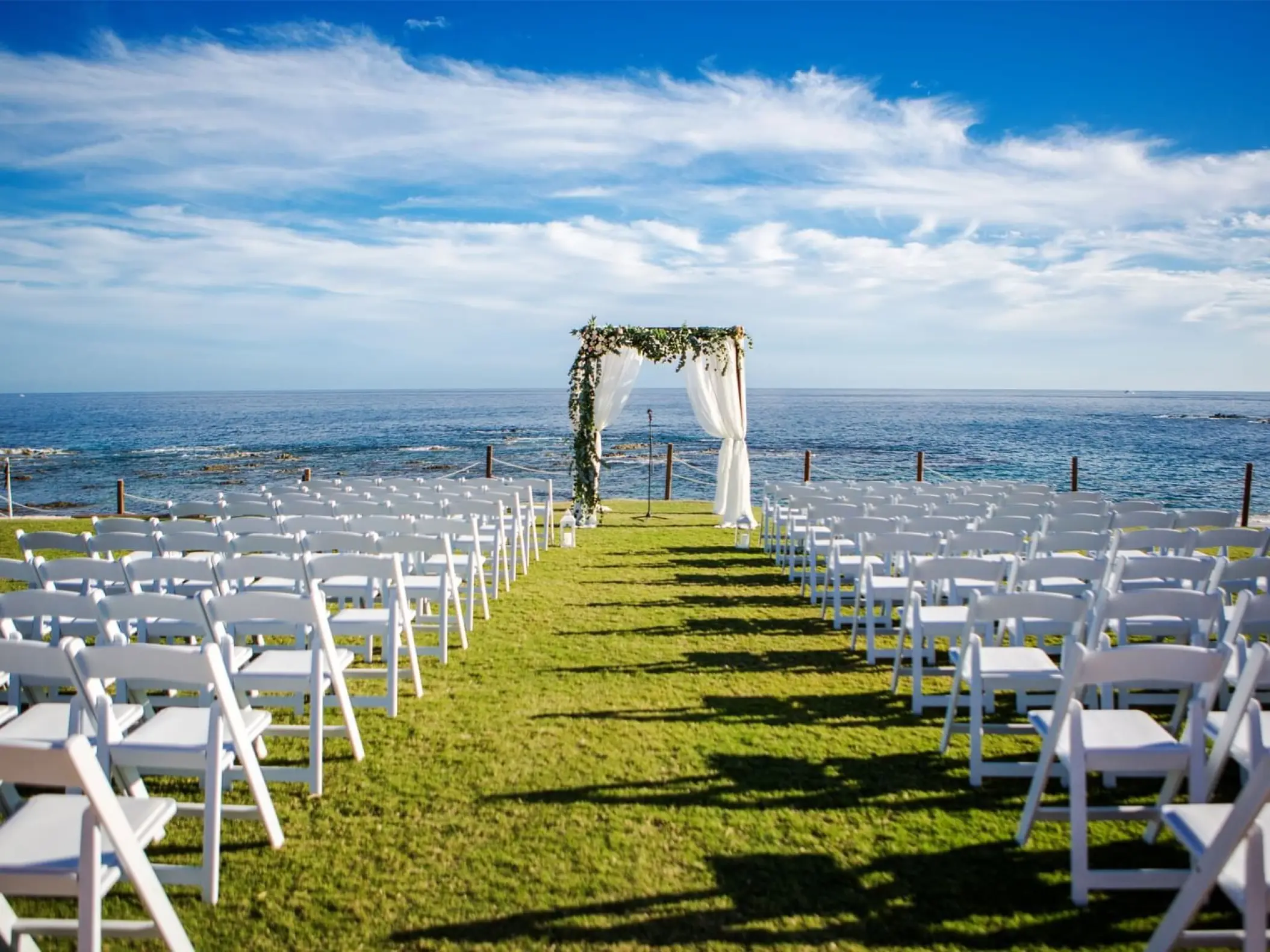 Oceanfront wedding ceremony setup on the lawn at Grand Fiesta Americana Los Cabos, Cabo San Lucas