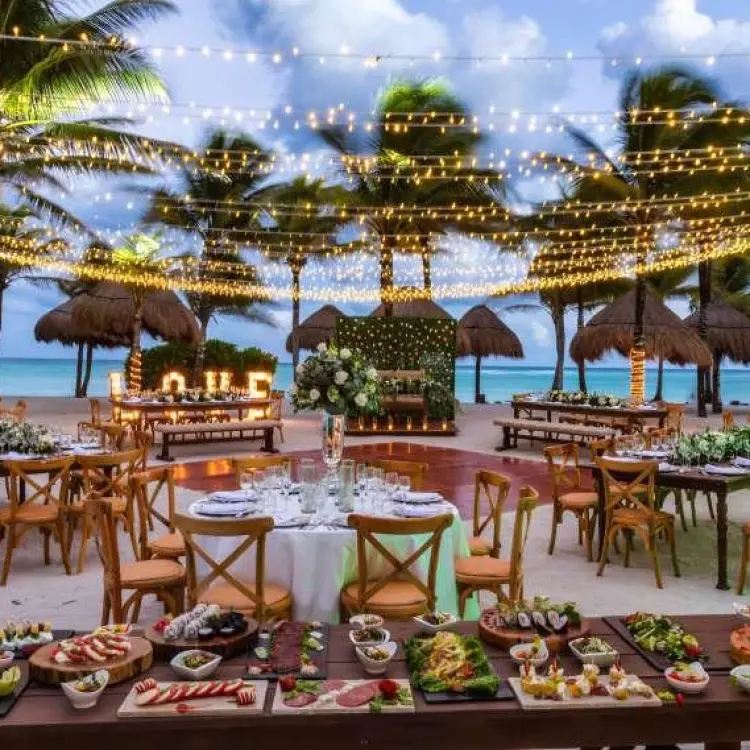 Beachfront wedding reception under string lights at Grand Palladium Colonial, Riviera Maya