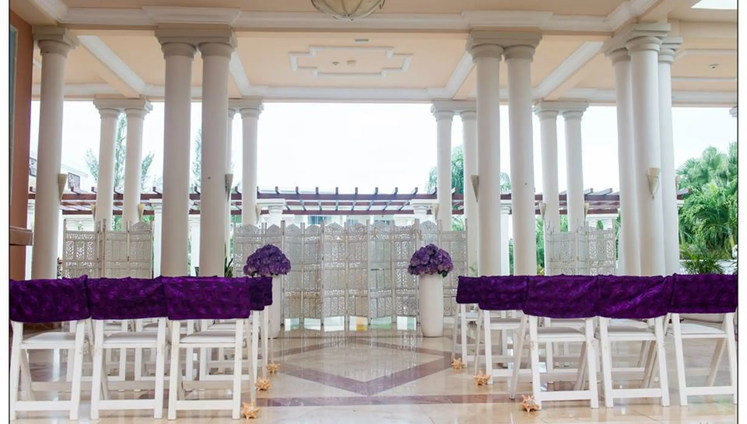 Ceremony in the angesl atrium at GRAND PALLADIUM LADY HAMILTON RESORT & SPA