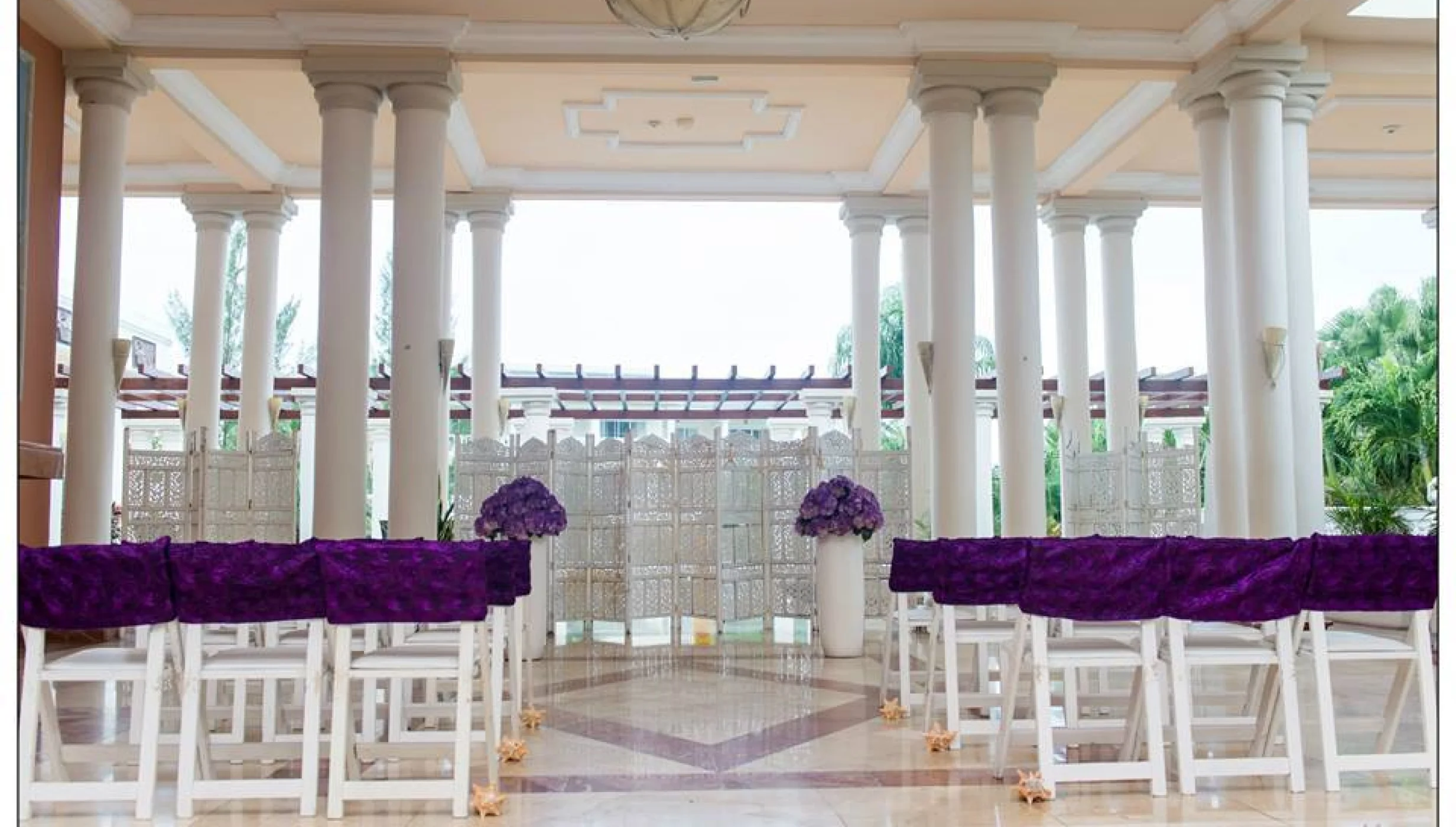 Ceremony in the angesl atrium at GRAND PALLADIUM LADY HAMILTON RESORT & SPA