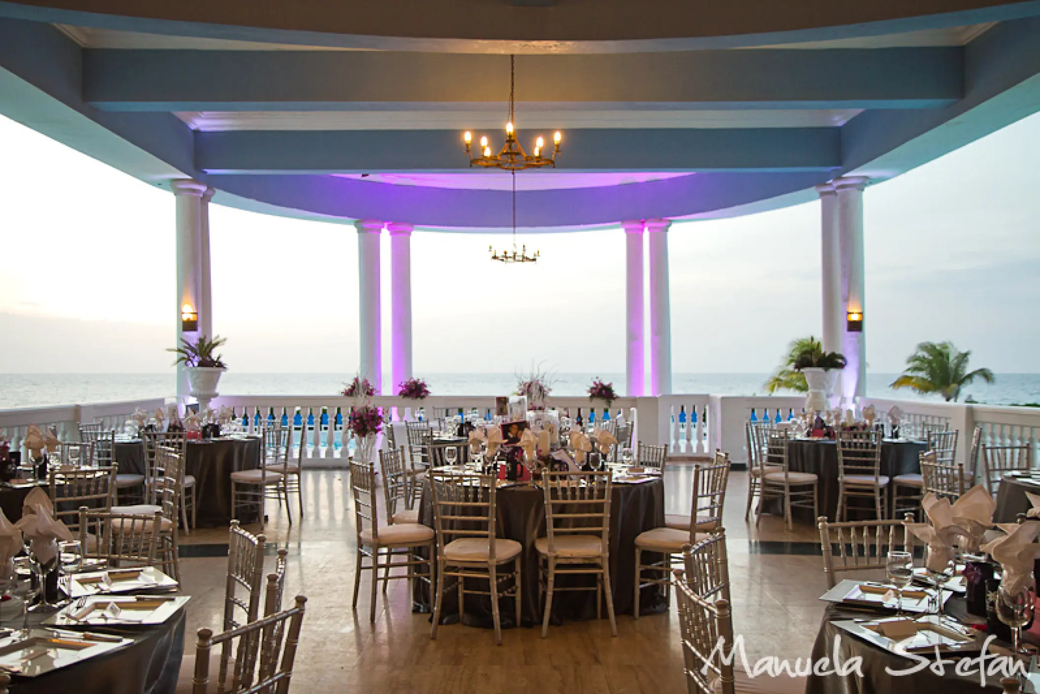Wedding reception with purple lighting at the covered terrace of Grand Palladium Lady Hamilton, Ocho Rios