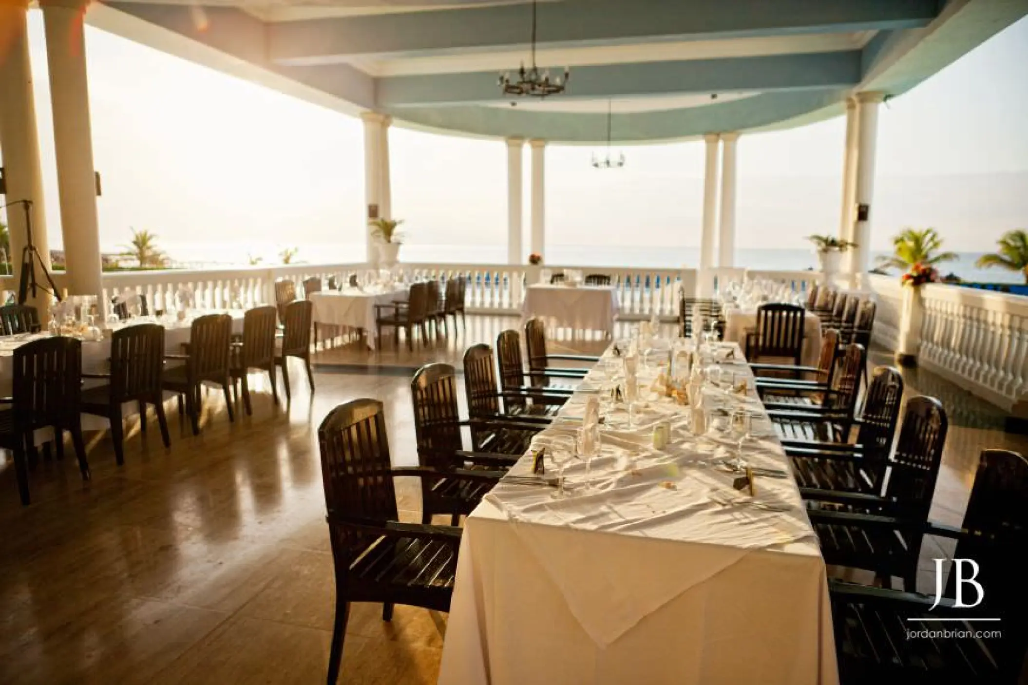 Outdoor wedding reception tables on the terrace at Grand Palladium Lady Hamilton, Ocho Rios