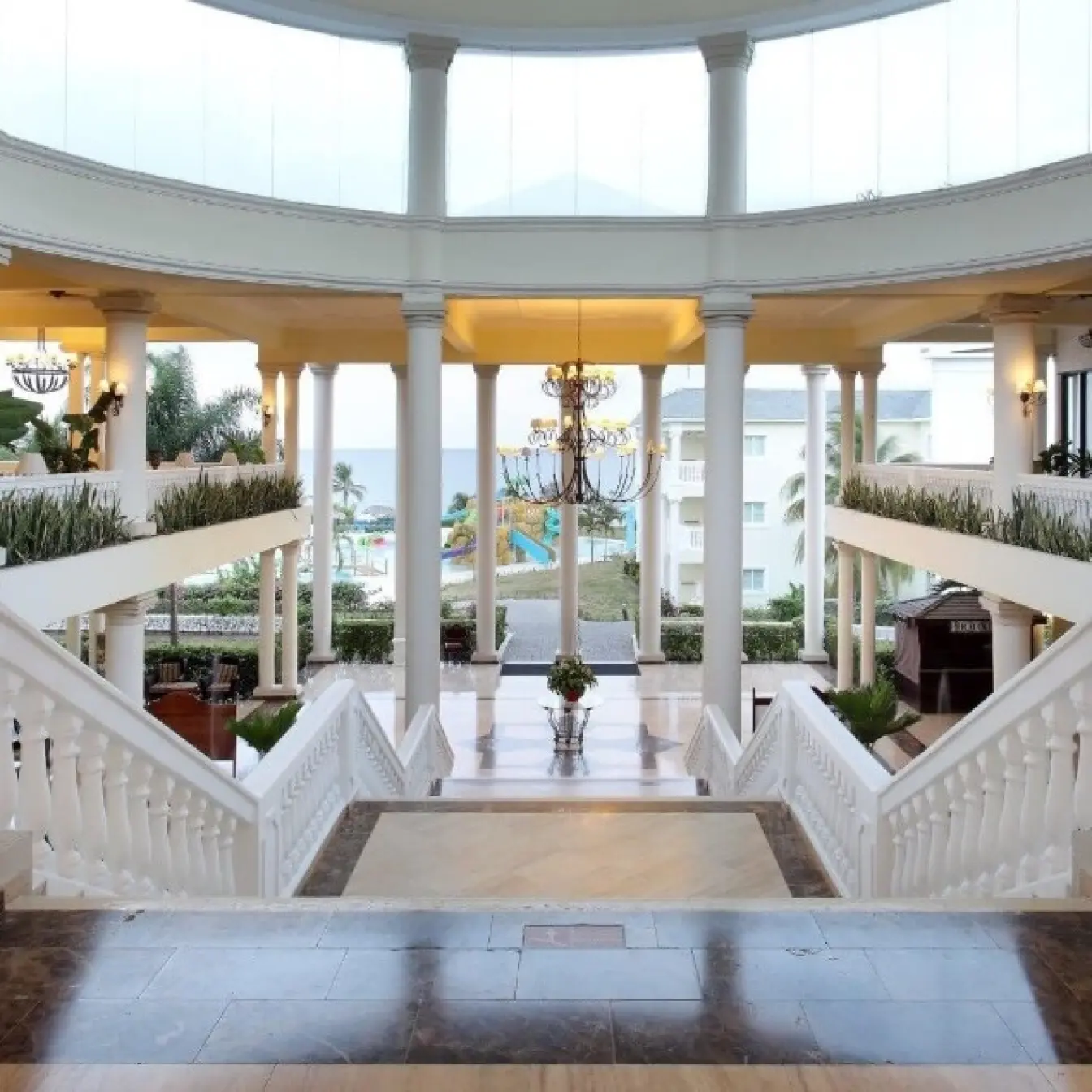 Grand Palladium Jamaica lobby featuring grand white pillars and symmetrical staircases, Ocho Rios