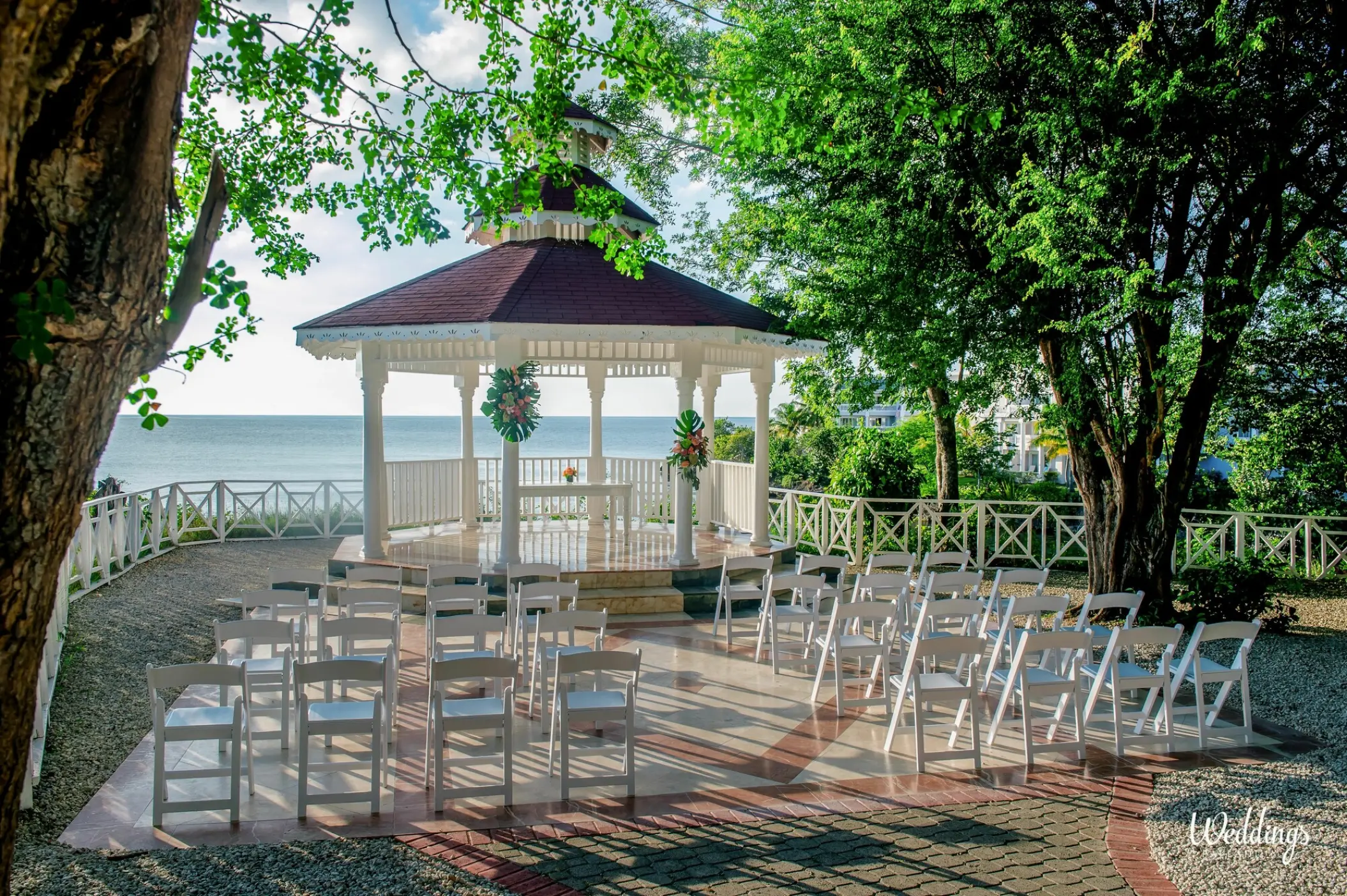 White gazebo wedding ceremony setup overlooking the ocean at Grand Palladium Jamaica, Ocho Rios