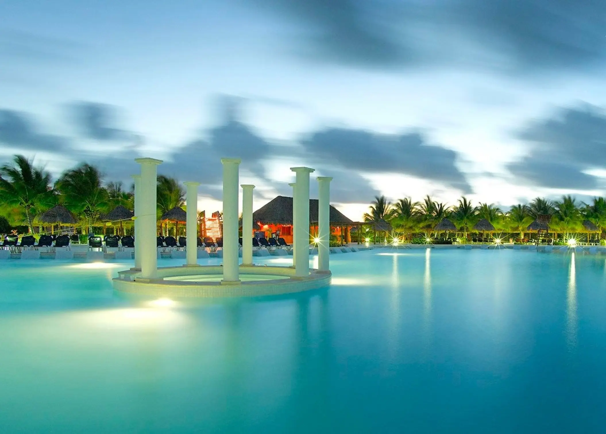 Grand Palladium Kantenah pool featuring white pillars at dusk, Riviera Maya