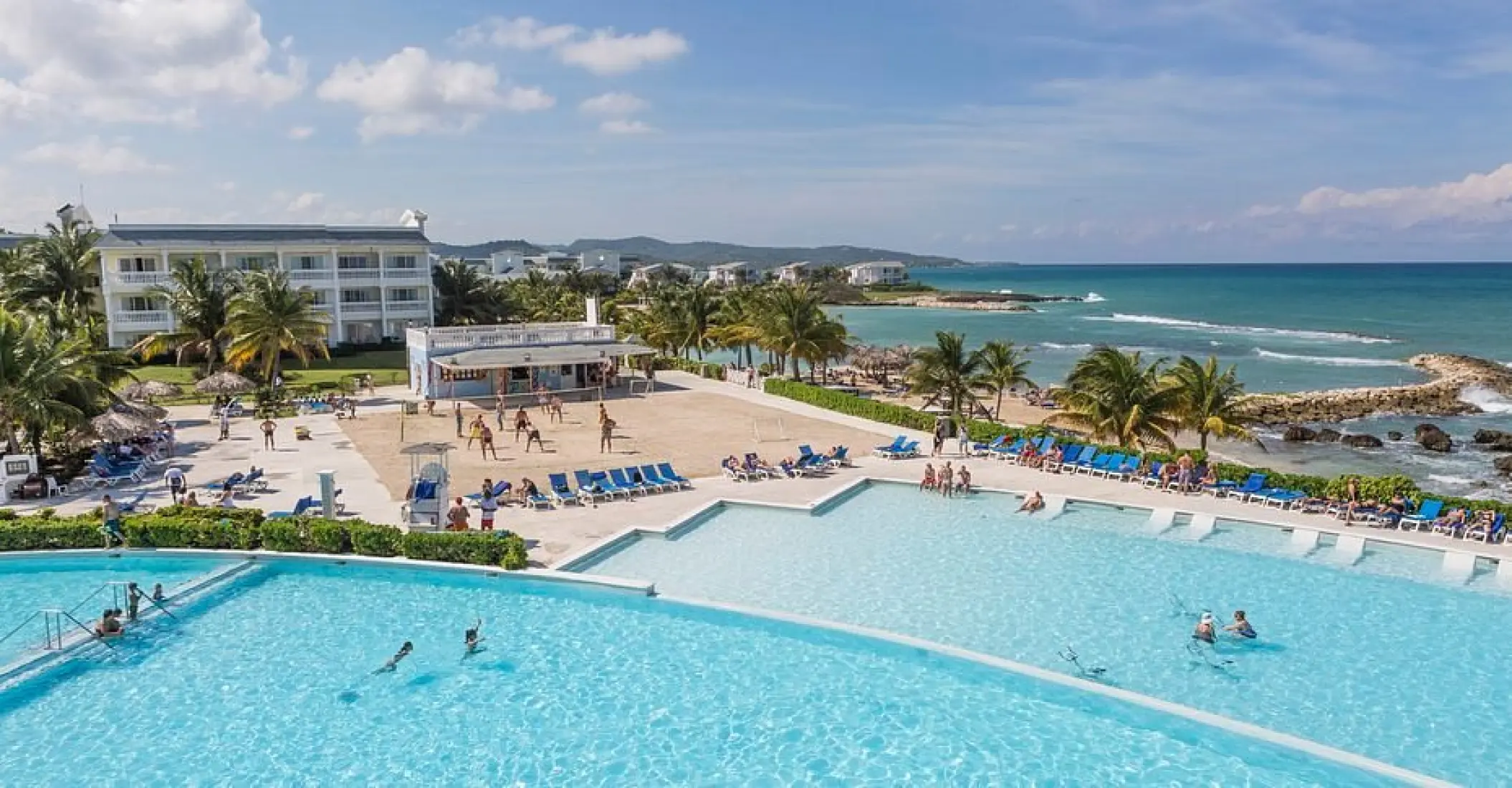 Grand Palladium Lady Hamilton infinity pool and volleyball court by the ocean, Ocho Rios