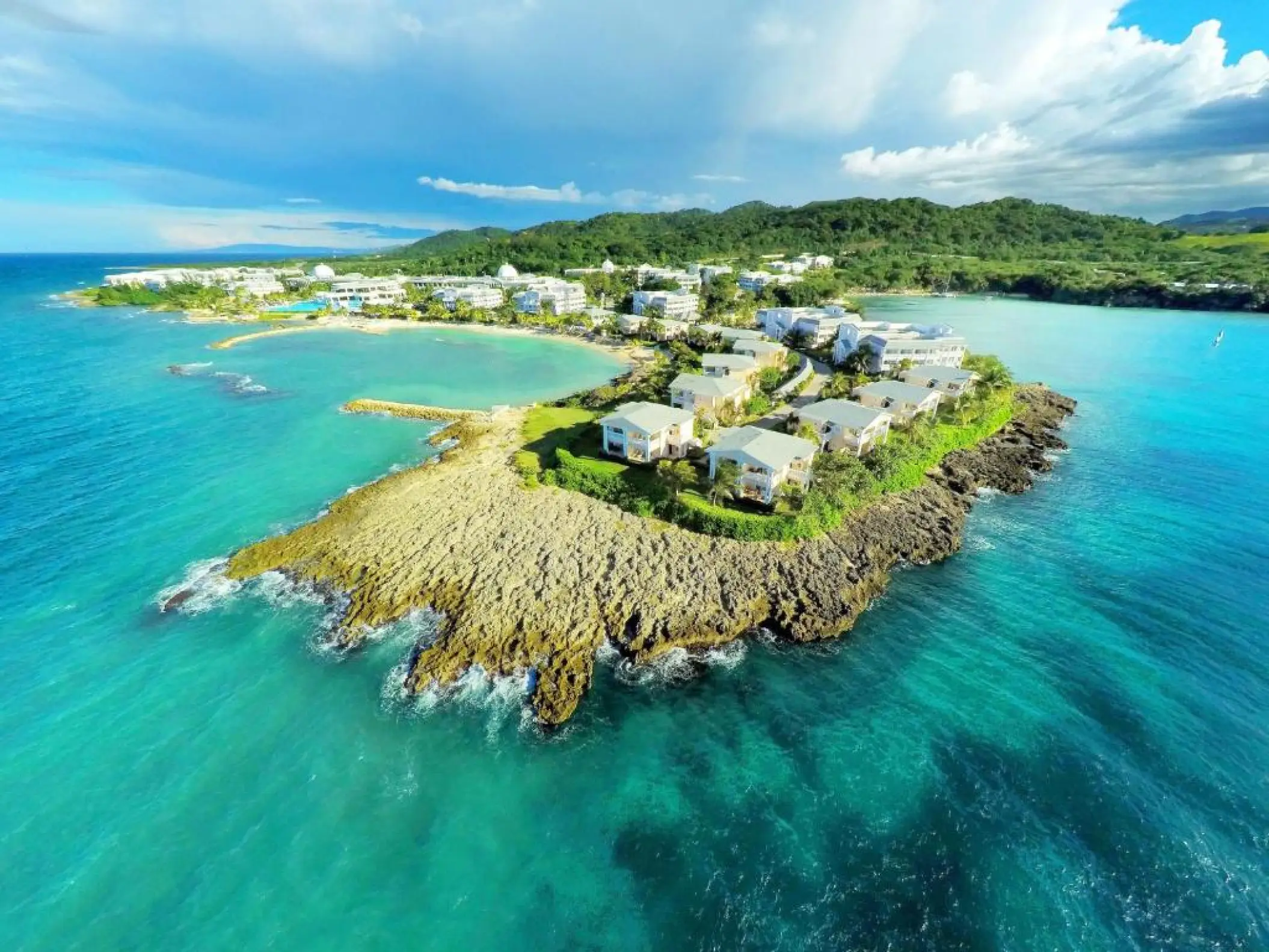 Aerial view of Grand Palladium Lady Hamilton suites on a rocky peninsula, Ocho Rios