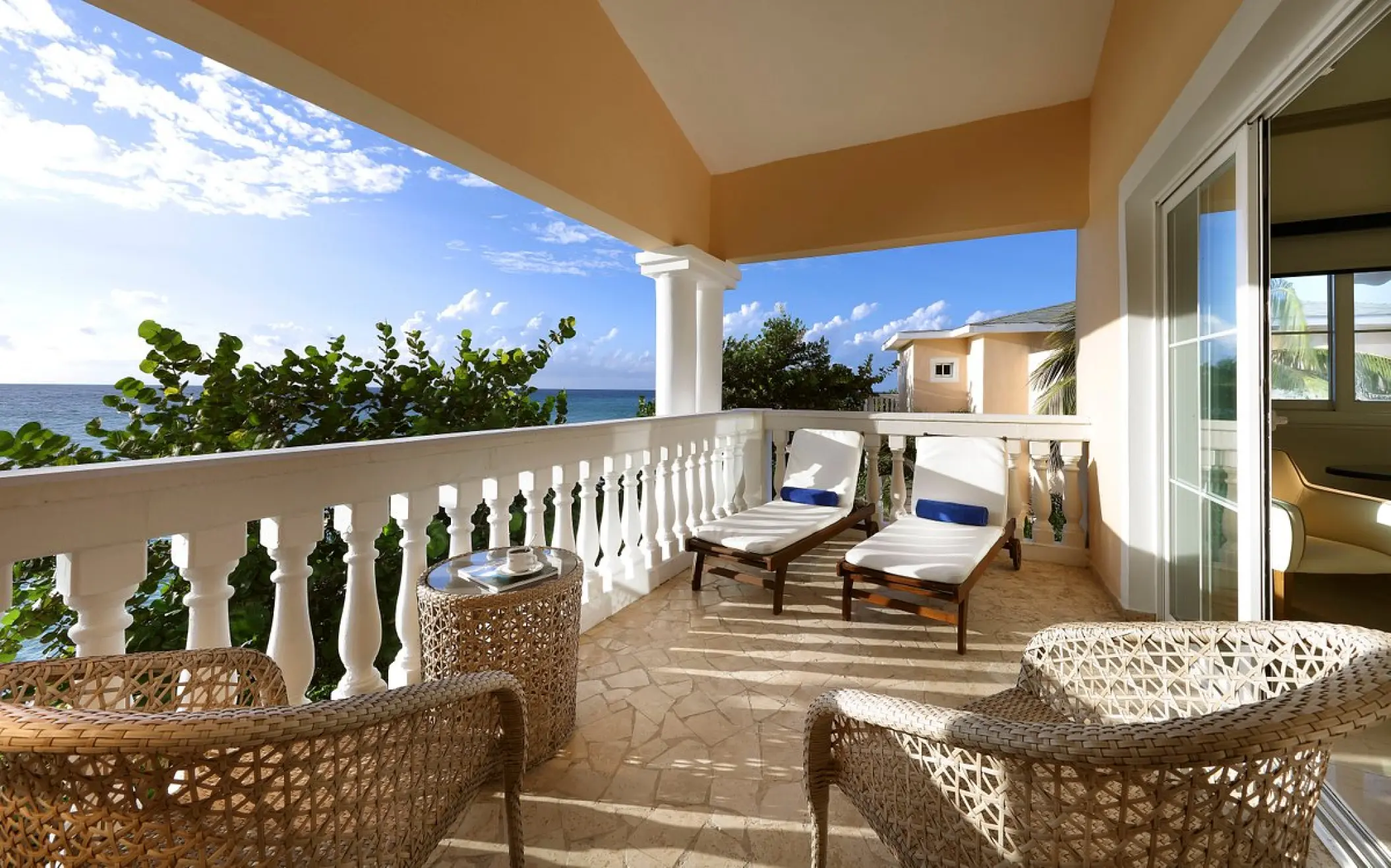 Private suite balcony with lounge chairs at Grand Palladium Lady Hamilton, Ocho Rios