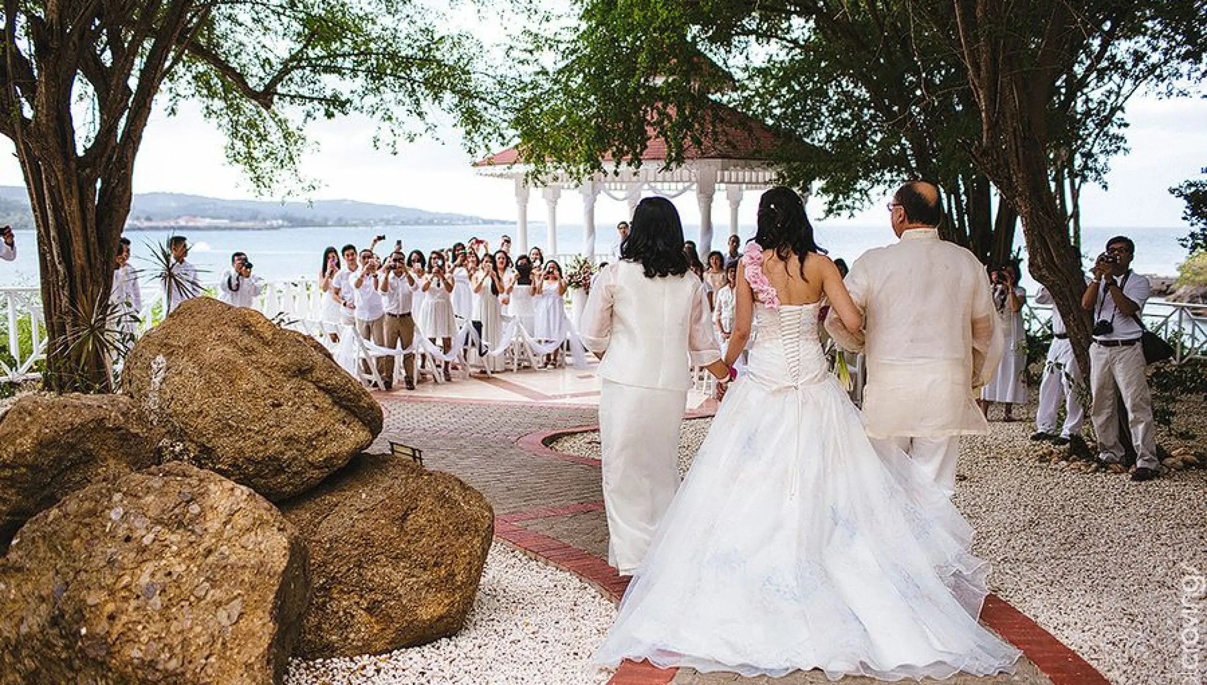 Angie walking down the aisle at a gazebo wedding ceremony at Grand Palladium Lady Hamilton, Ocho Rios