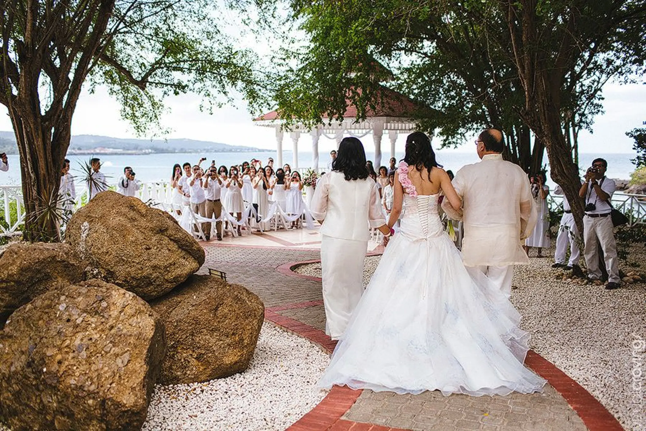 Angie walking down the aisle at a gazebo wedding ceremony at Grand Palladium Lady Hamilton, Ocho Rios
