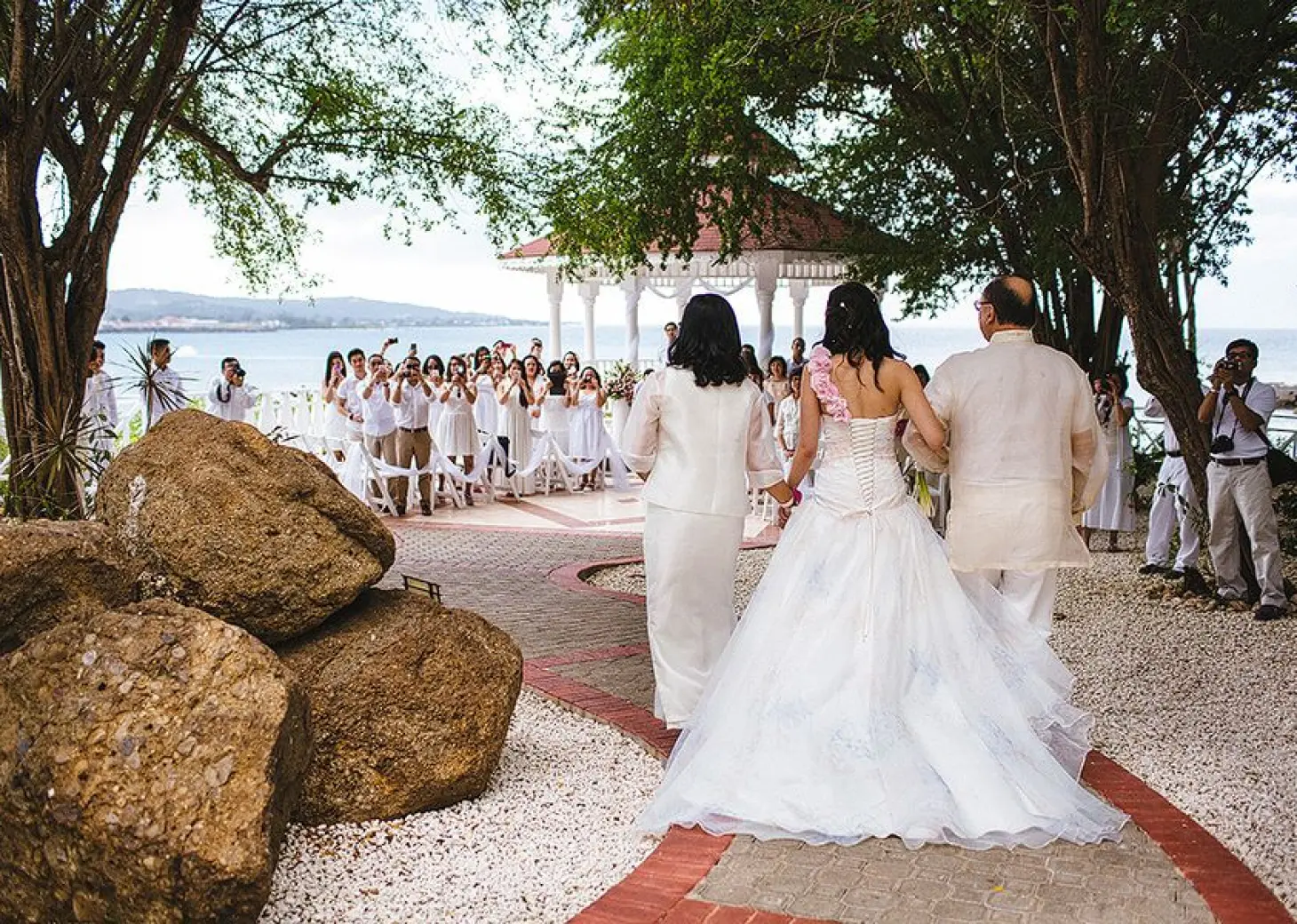 Angie walking down the aisle at a gazebo wedding ceremony at Grand Palladium Lady Hamilton, Ocho Rios