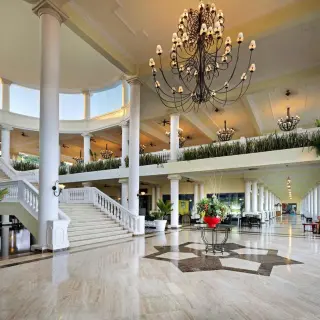Grand Palladium Lady Hamilton open-air lobby with chandeliers and grand staircase, Ocho Rios