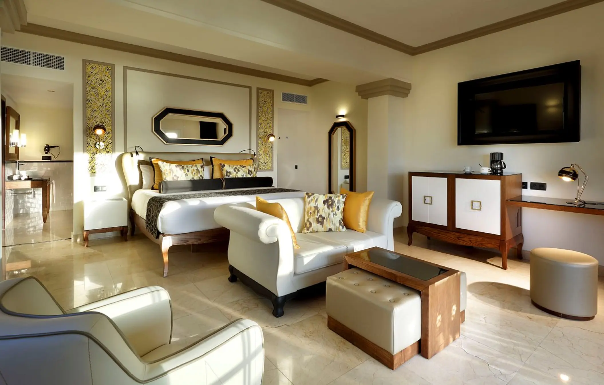 Grand Palladium Lady Hamilton modern suite with living area and king bed, Ocho Rios
