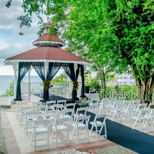 Clifftop wedding ceremony gazebo with black draping at Grand Palladium Lady Hamilton, Ocho Rios