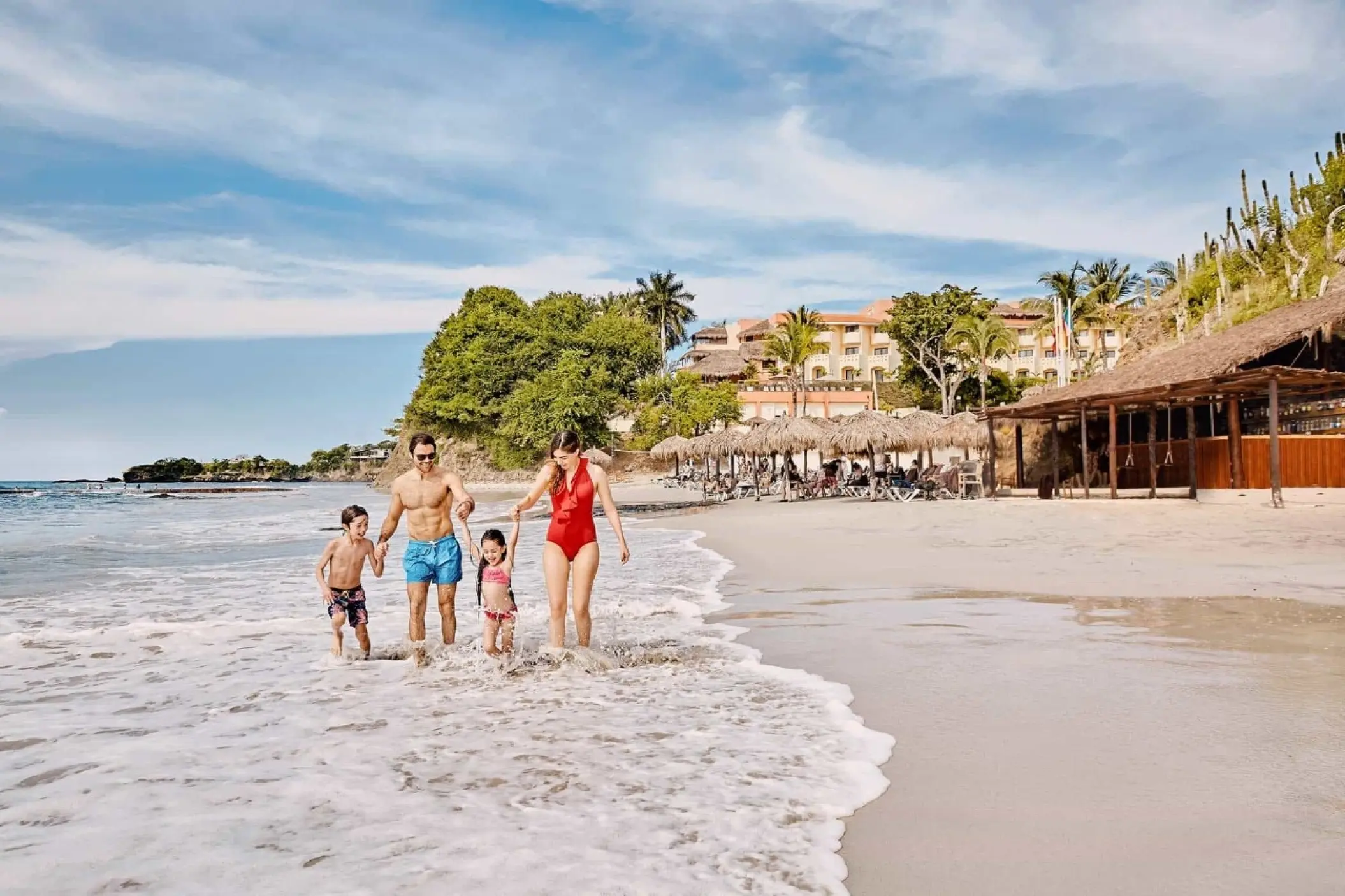 Family walking along the shore at Grand Palladium Vallarta, Puerto Vallarta