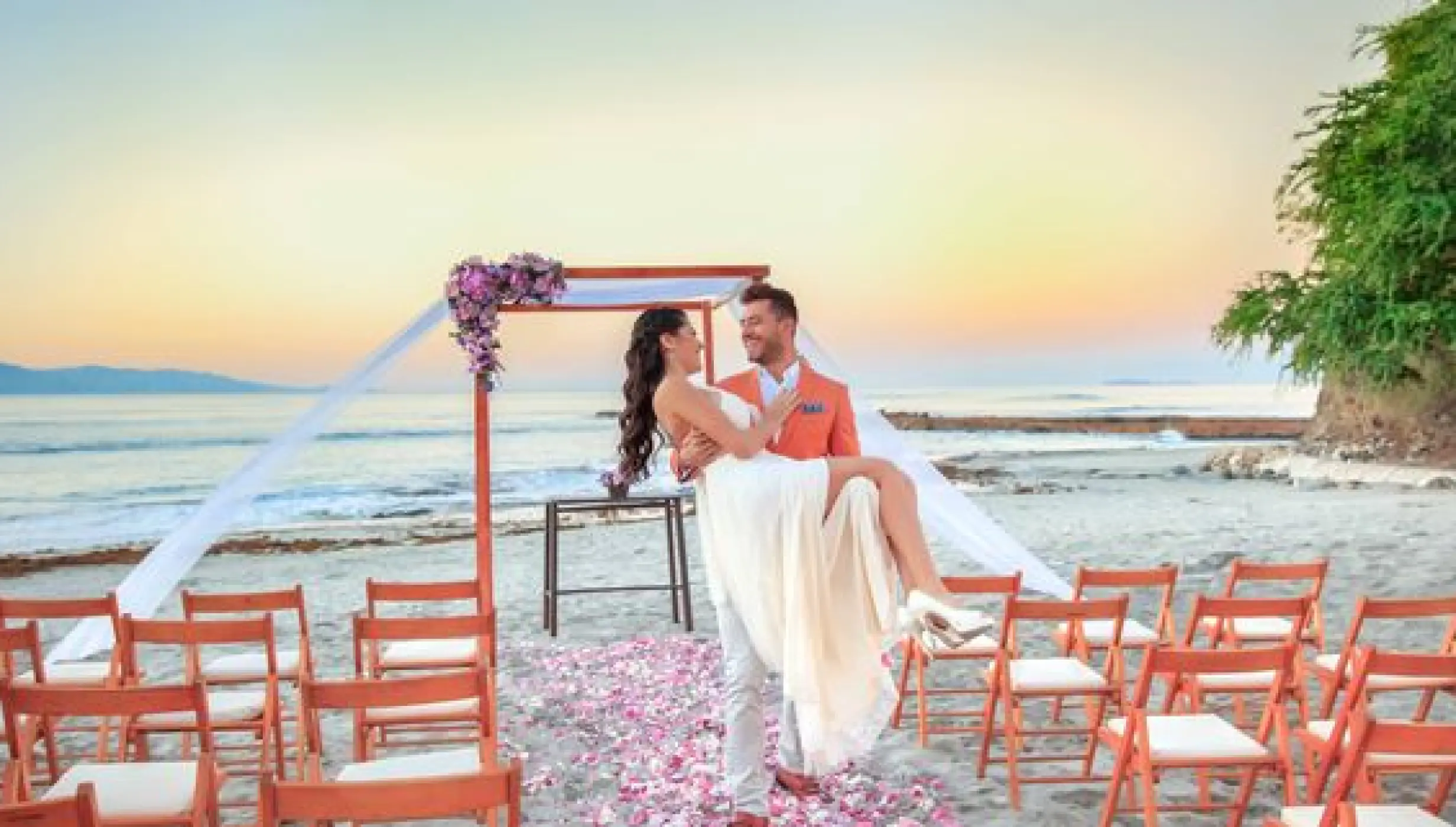 Couple on the beach pergola at grand palladium vallarta