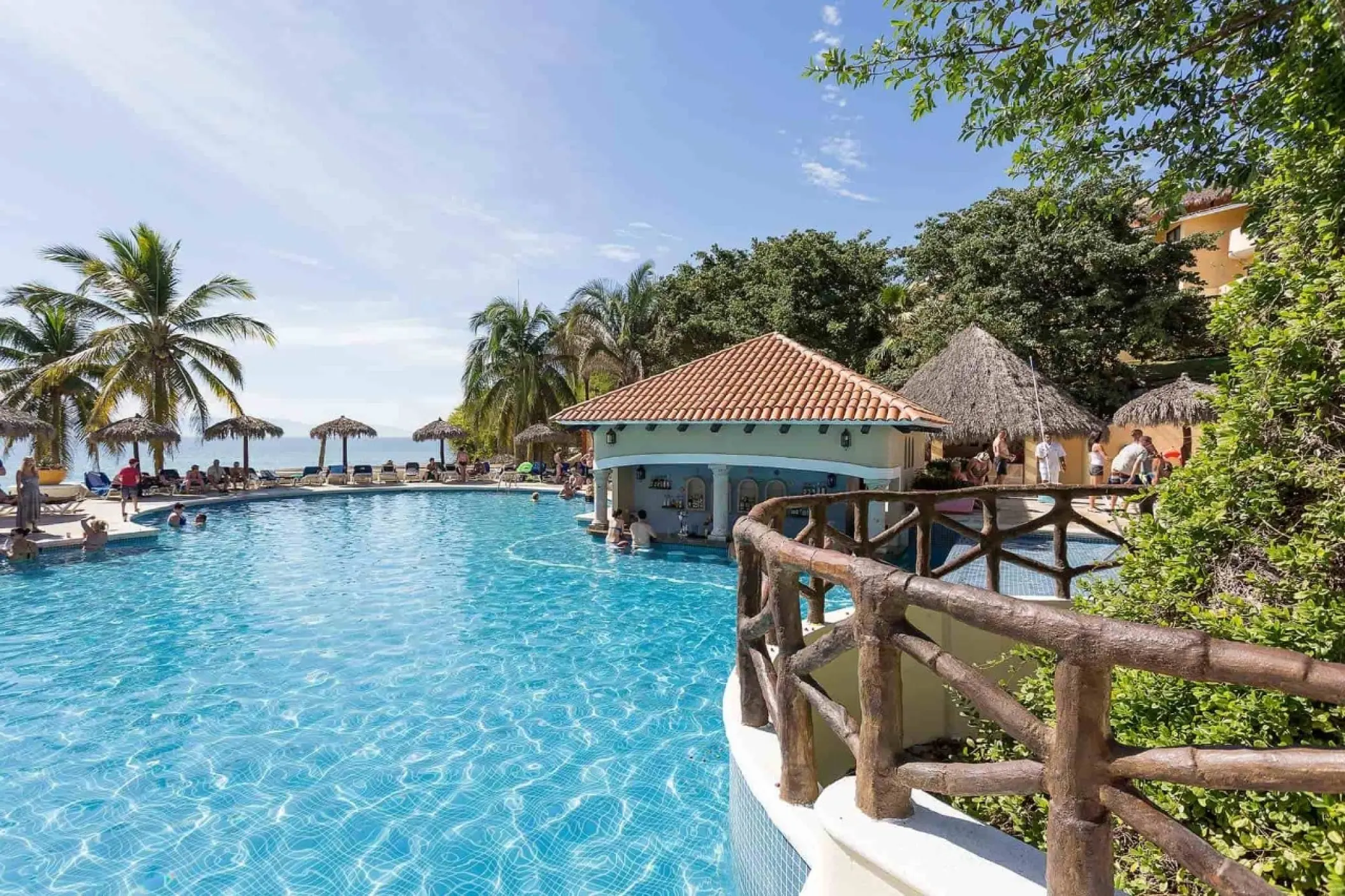 Main swimming pool with a swim-up bar at Grand Palladium Vallarta, Puerto Vallarta