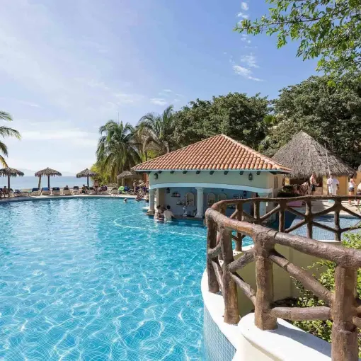 Main swimming pool with a swim-up bar at Grand Palladium Vallarta, Puerto Vallarta