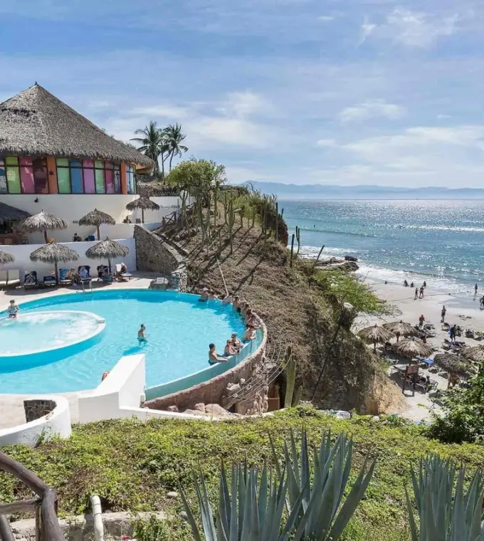 Grand Palladium Vallarta beachfront pool and palapas overlooking the ocean, Puerto Vallarta