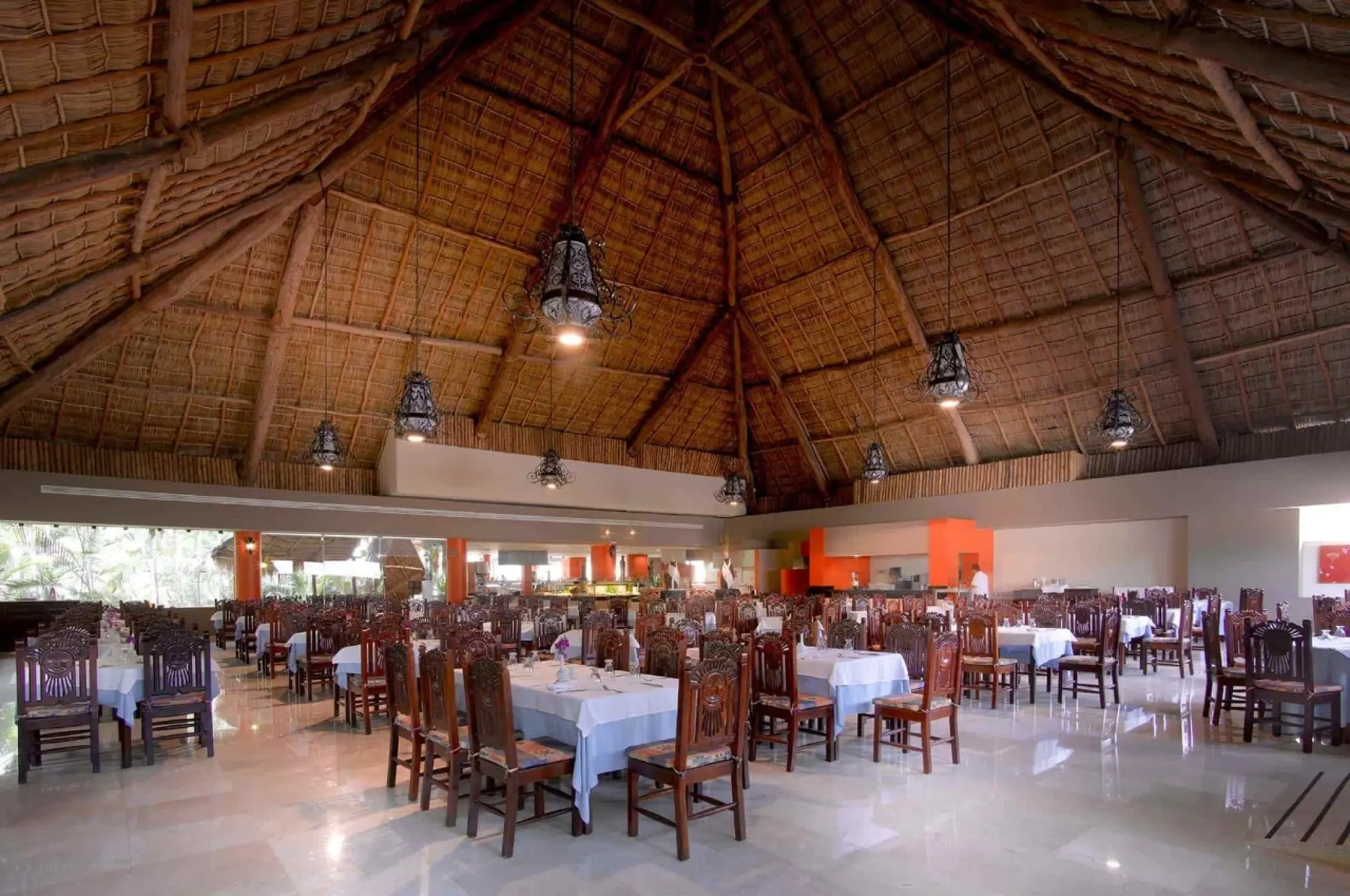 Grand Palladium Vallarta restaurant with wooden furniture under a high thatched palapa roof, Puerto Vallarta