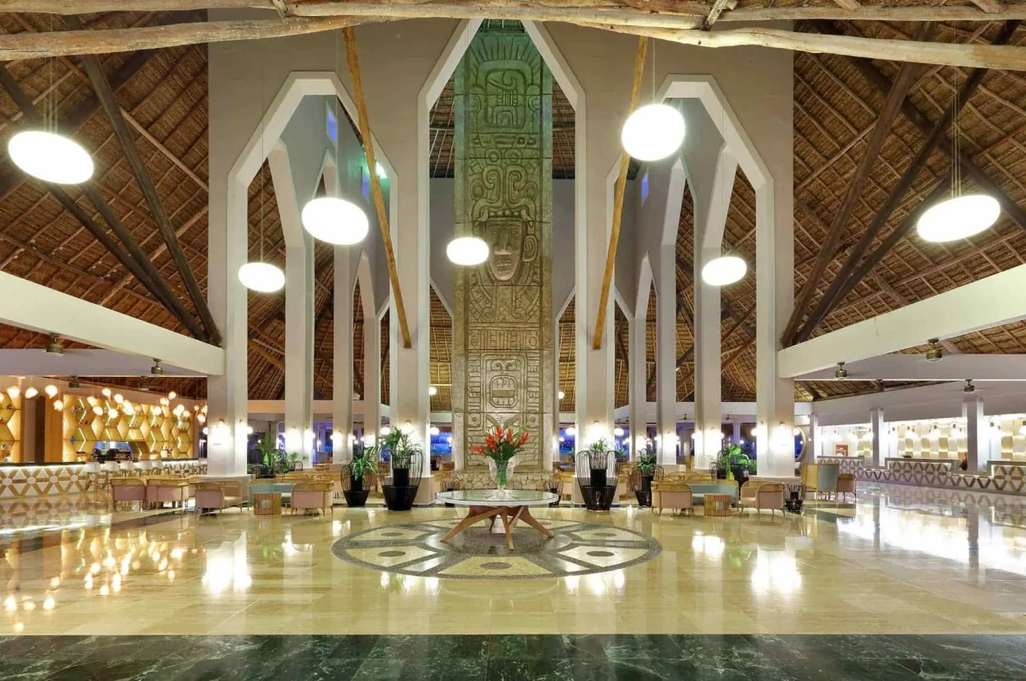 Grand Palladium White Sand lobby with high thatched ceilings and stone pillars, Riviera Maya