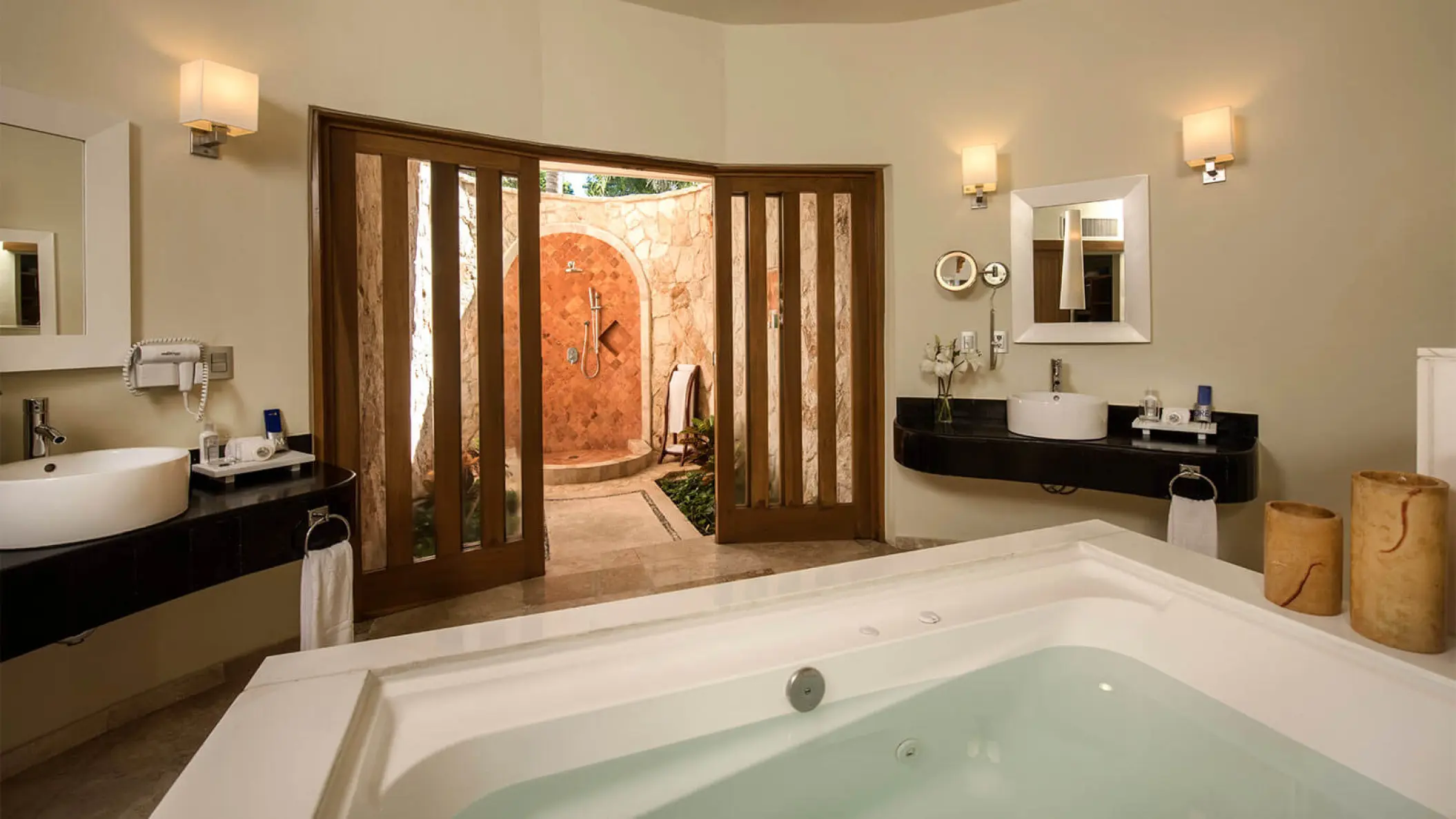 Grand Riviera Princess bathroom suite with a large soaking tub and outdoor shower access, Playa Del Carmen