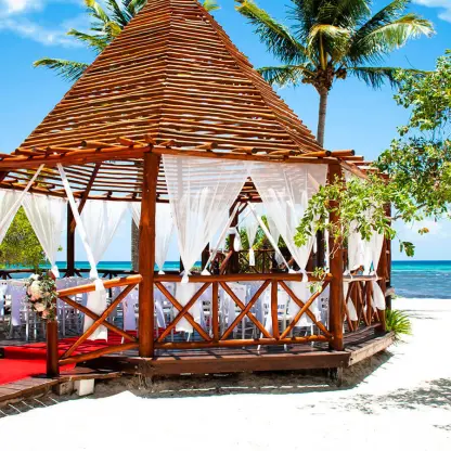 Beachfront wedding ceremony gazebo with red aisle runner at Grand Riviera Princess, Playa Del Carmen