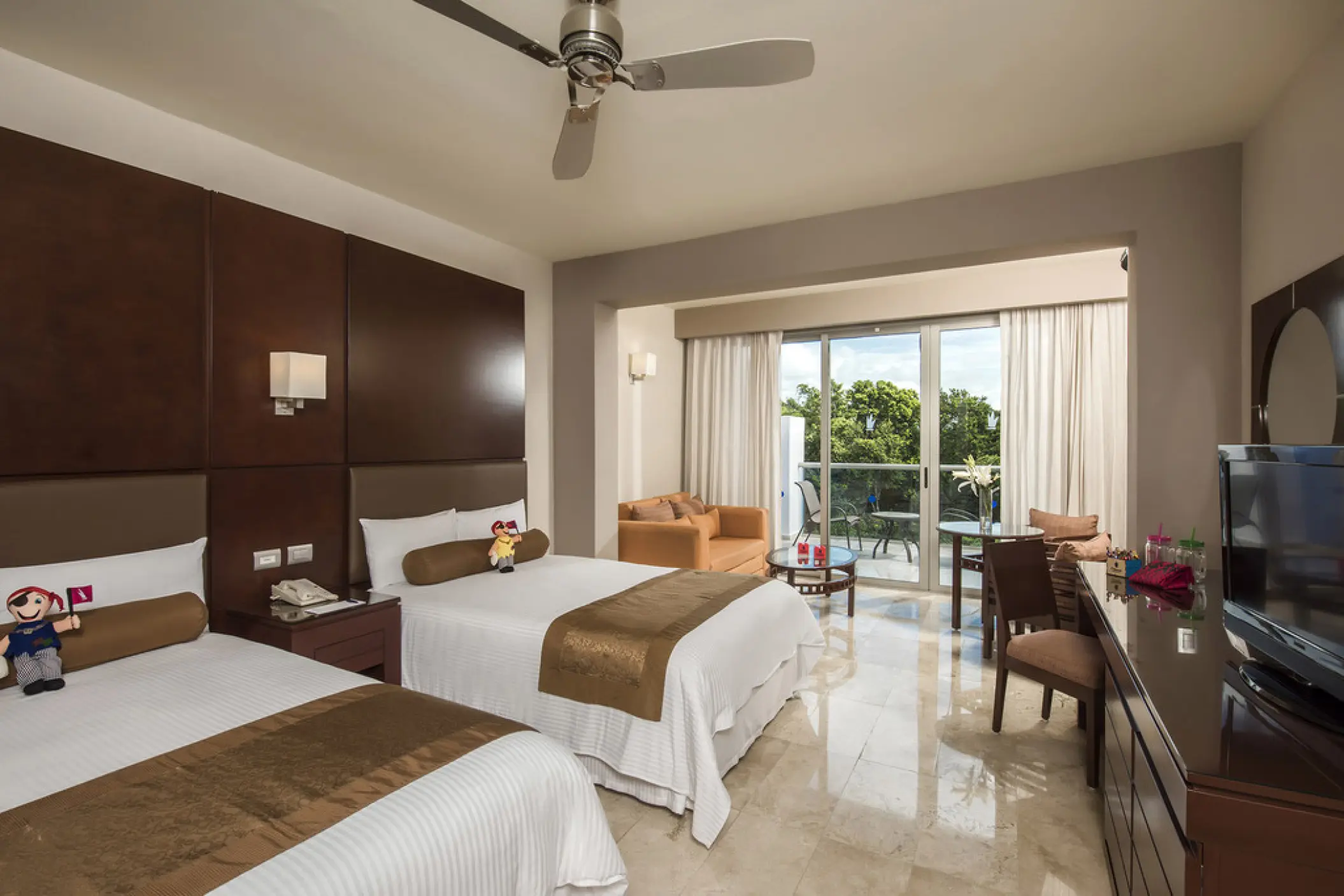 Guest room with two double beds and a private balcony at Grand Riviera Princess, Playa Del Carmen