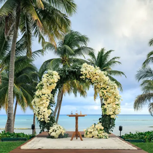 Circular floral wedding ceremony arch on the Grand Class deck at Grand Velas Riviera Maya