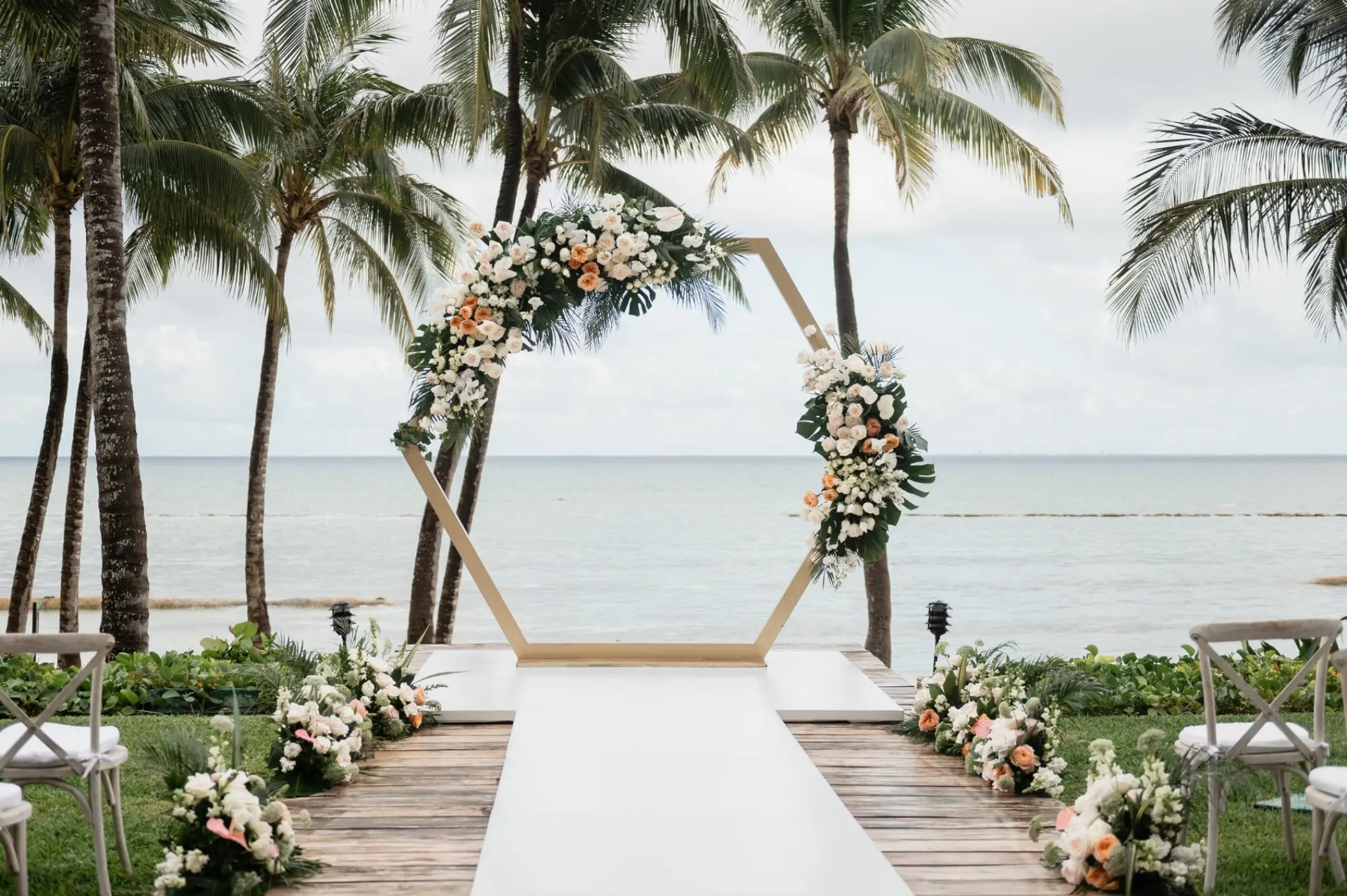 Hexagonal floral arch for a beach ceremony at Grand Velas Riviera Maya