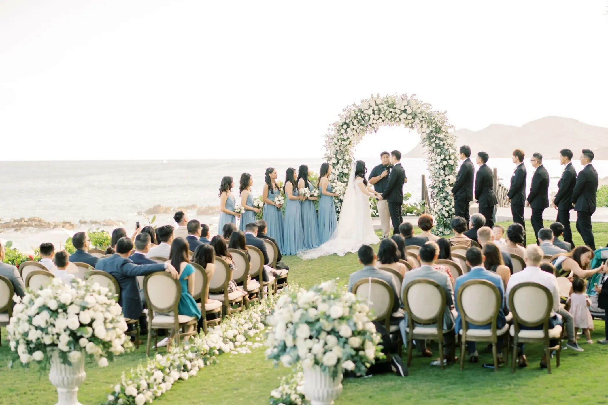 Oceanfront garden wedding ceremony at Grand Velas Los Cabos, Cabo San Lucas